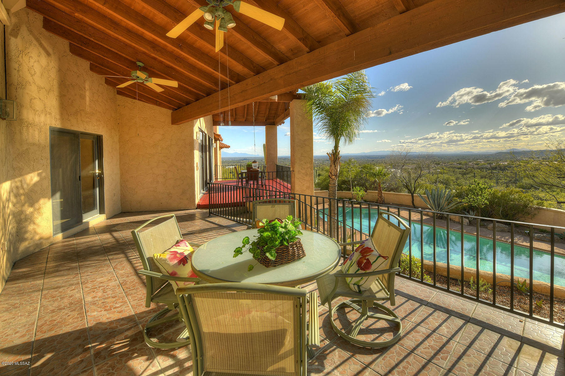 Seller will accept or counter offers between $870,000 and $900,000. Spectacular Home on a Hillside offers Amazing City & Mountain Views. Several Outdoor Areas to Enjoy the Beauty of the Catalina Mountains & Tucson City lights.  This 5 Bedroom Stunning Home Features a Master Suite along w/ 2 Guest Suites in the Main house. The Guest Quarters has 2 Bedrooms w/ 1 bath. Cathedral Ceilings with Large Glass Windows and Doors take Advantage of the Impressive views throughout the house.  A Generous, Bright open Kitchen with Granite Countertops, High Ceilings and Large Windows open into a Delightful Eating Area Surrounded by Windows. An extra-large 6 car Mechanics Garage offers additional space for a Workshop as well as a ½ Bath. This Estate situated on a 2+ Acre, Elevated lot.