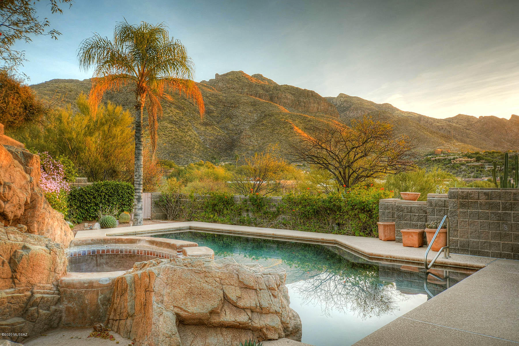Enjoy Majestic Mtn/City Views in this Sin Vacas Masonry Home! 4 Bdrm Plus Den, 4 Bath, 4213 sf w/Privacy. Lg, Open Great Room has High View Windows w/Gas Log FP. Spacious Kitchen Features Granite counters, Dbl Ovens, Oversize Sink & Desk Area. Kitchen Opens Up to Dng Area on One Side & Breakfast Room (w/Private Patio). Family Room On the Opposite Side. M Bdrm Features City Views to the South, Gas Fireplace, Built-In Entertainment Center & Access to Pool Area. MBath has His/Her Vanities, Jetted Tub/Lg Shower. Guest Bdrms are Anchored by a Jack & Jill Bath w/Tub/Shower & Dual Sinks. Separate Guest Quarters off Garage w/Quiet Patio, Tile Floors & Murphy Bed. Abundant Stg in Garage, including a Storage Room that is Heated & Cooled. Secluded Yard incl Pool, Spa, Built-In BBQ, FP/Putting Green