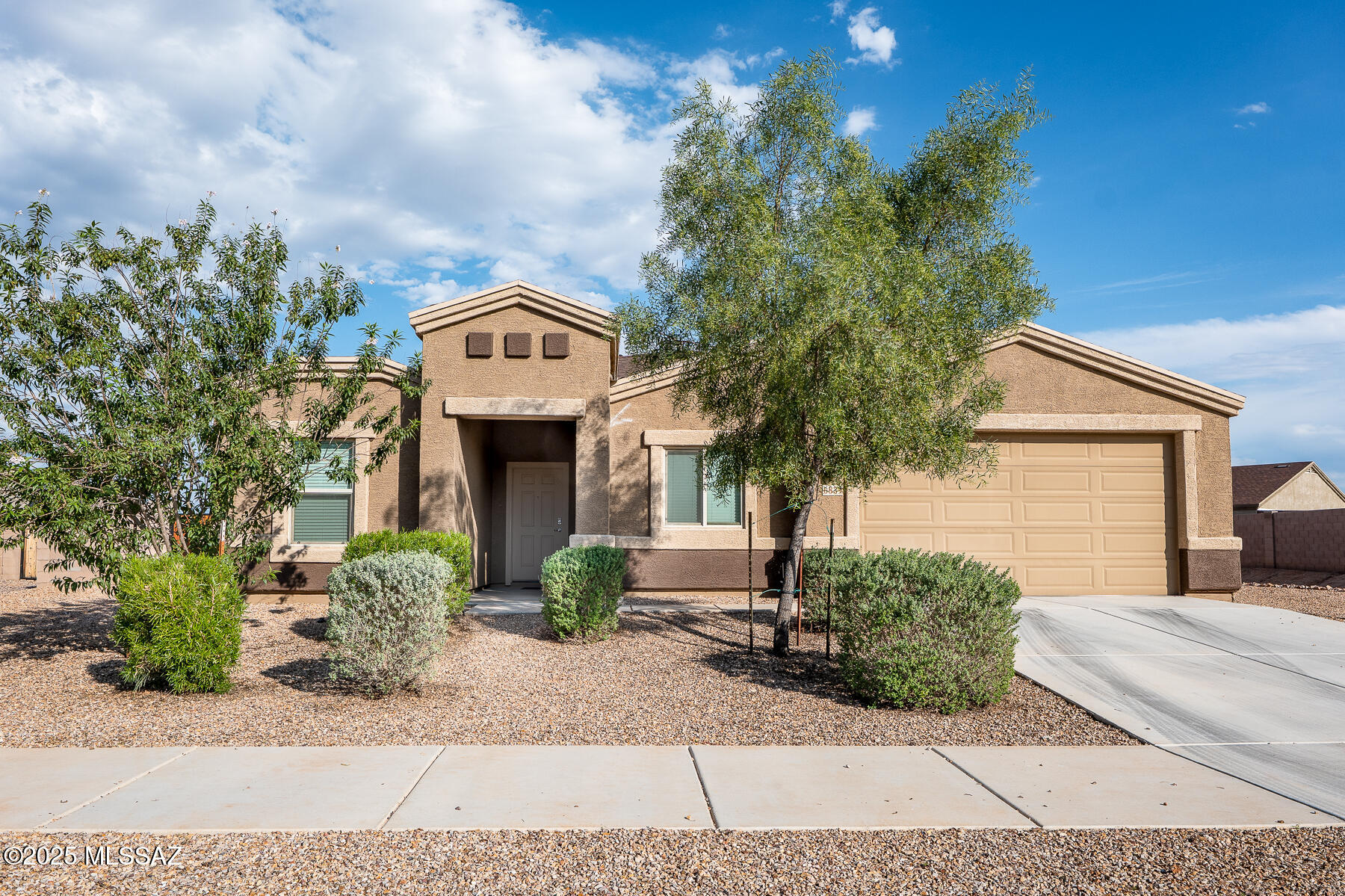 Range priced. Seller will accept or counter offers between $355,000 and $365,000. Escape the hustle and bustle of the city with this charming 4-bedroom, 2 bath contemporary located in quiet Valhalla Estates. The bright, modern  kitchen features an island, quartz countertops, stainless appliances, and a dining area open to the great room  The spacious primary suite includes high ceilings and an ensuite that also features quartz countertops and dual vanities. Enjoy the professionally designed backyard with mountain views, pavers, fire pit, and covered patio perfect for the entertainers. Outdoor enthusiasts will love the proximity to the open desert and being just minutes from Saguaro National Park West with all it has to offer. A short drive south and you are at the awesome Buenos Aires Refuge. This home is move in ready and waiting for you