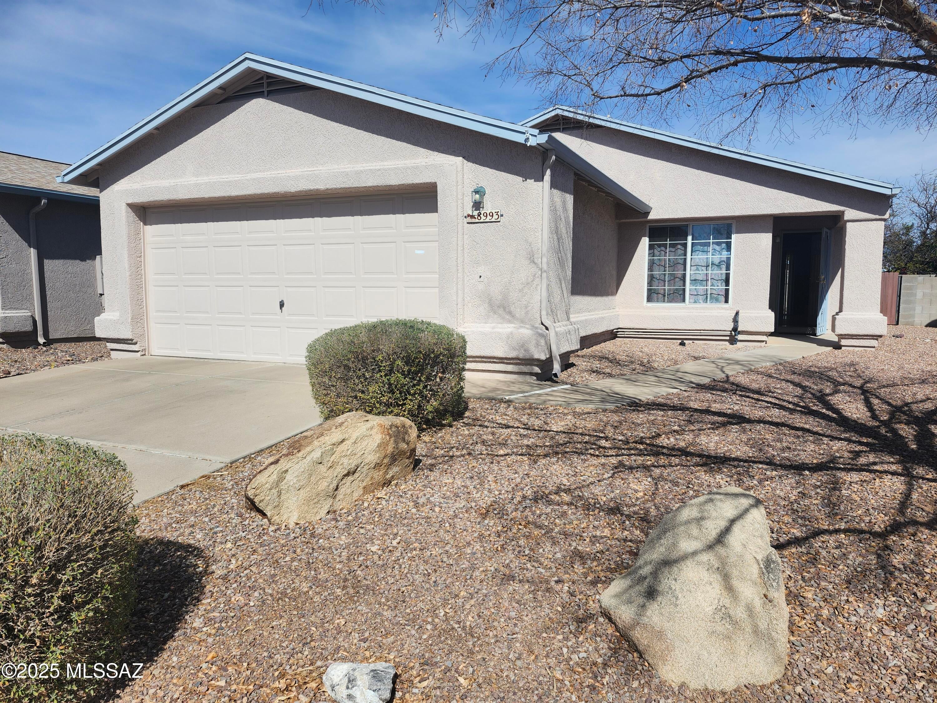 Charming & Move-In Ready 3-Bedroom Home in East Tucson! Welcome to this beautifully maintained 3-bedroom, 2-bath home, featuring brand-new vinyl laminate flooring, stainless steel appliances with a neutral palette. Designed with comfort and convenience in mind, this home boasts a spacious covered patio with brick walkways, perfect for outdoor relaxation. The 2-car garage offers ample storage with built-in cabinets. Attention to detail is evident throughout, making this home warm and inviting. Ideally located near Fred Enke Golf Course, Pima Community College East Campus, Davis-Monthan Air Force Base, shopping, and more!