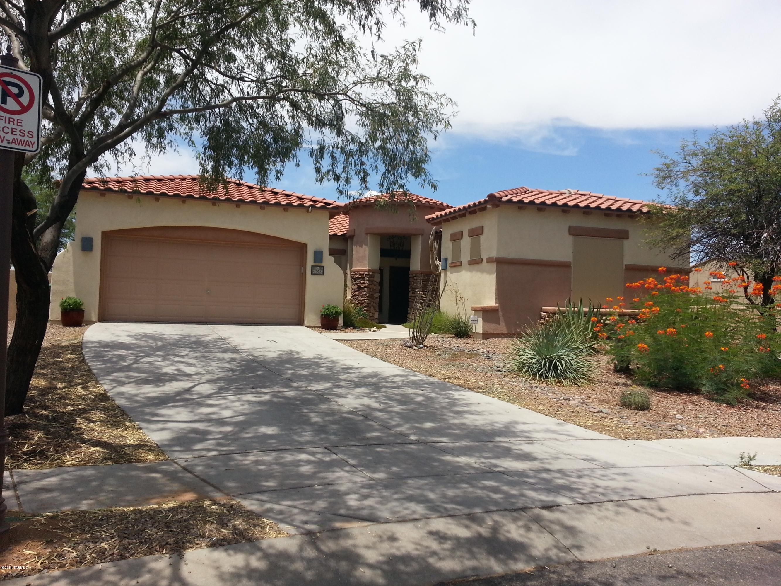 Beautiful home in Rancho Sahuarita offering multiple amenities including parks, lake, water park, workout facilities and more. The property offers lush landscaping, and pretty patios, with the back yard backing to open space. You will love the open floor plan with large great room, plus den. Convenient to shopping, restaurants, and services.