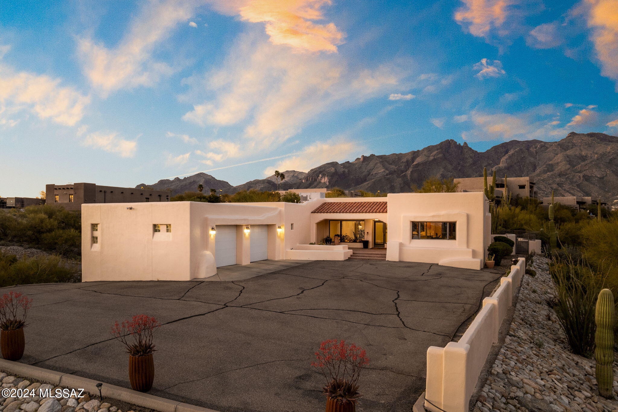 This stunning property offers a gated, private hilltop retreat spanning 1.52 acres. Enjoy breathtaking panoramic city and mountain views from this fully remodeled residence including all new flooring, new interior and exterior paint, air conditioner, and new commercial water heater & water softener. Fully upgraded kitchen with all new top-of the line appliances, cabinetry, counters and pantry. Located adjacent to the esteemed Hacienda Del Sol Resort and Restaurant, this home boasts luxurious living in a serene desert landscape.