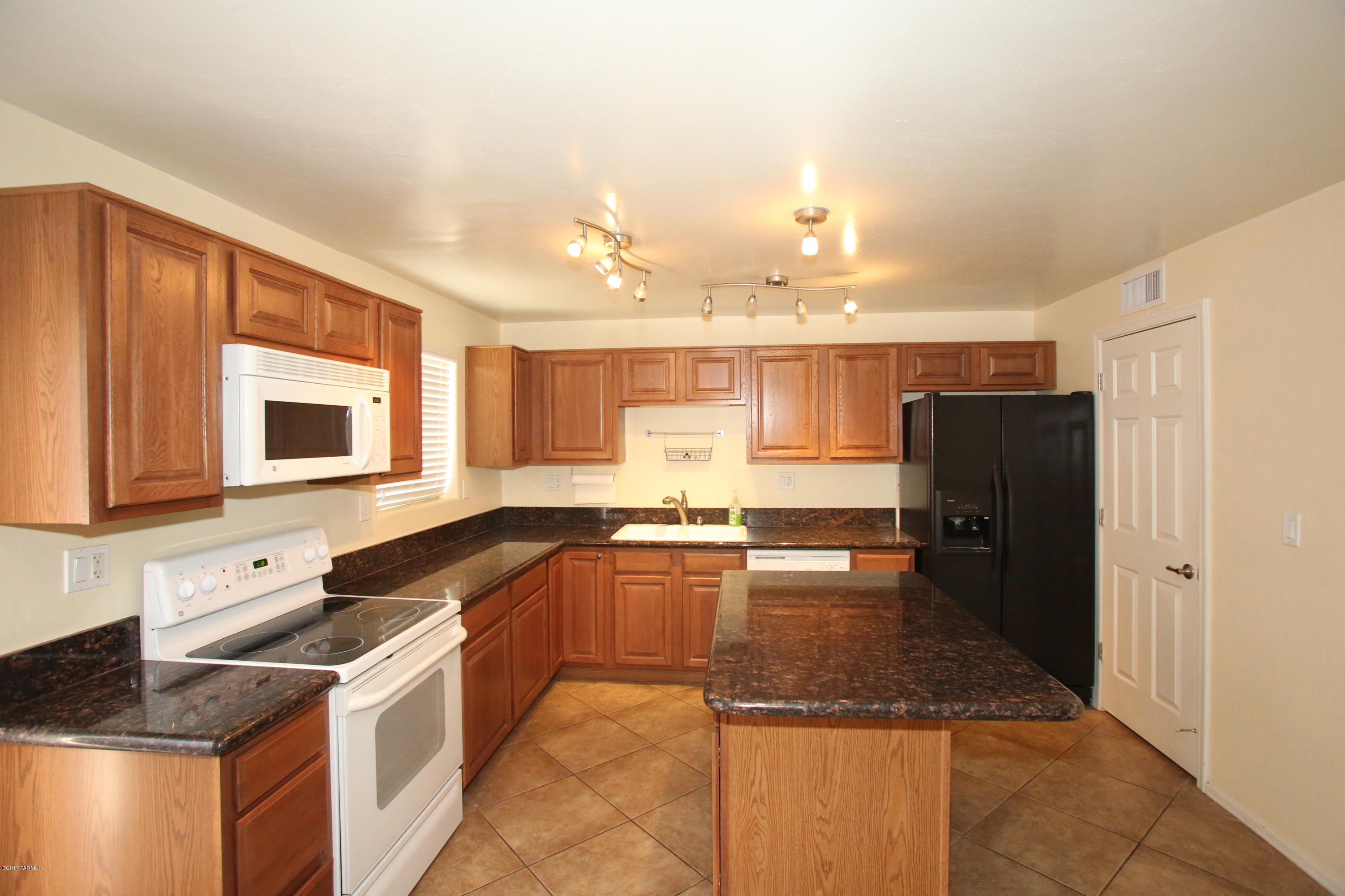 Super Cute 3 bedroom 1.5 bath over 1300 sq ft! Owner is paying for water, electric and gas! Nice tile and newer carpet that features granite counter-tops, center island is a breakfast bar! It has a  smooth top electric stove and a microwave and a nice pantry. A Large living room gives you room to store all your stuff. There is a community pool as well! 1 Cat ok. Contact agents for more information.