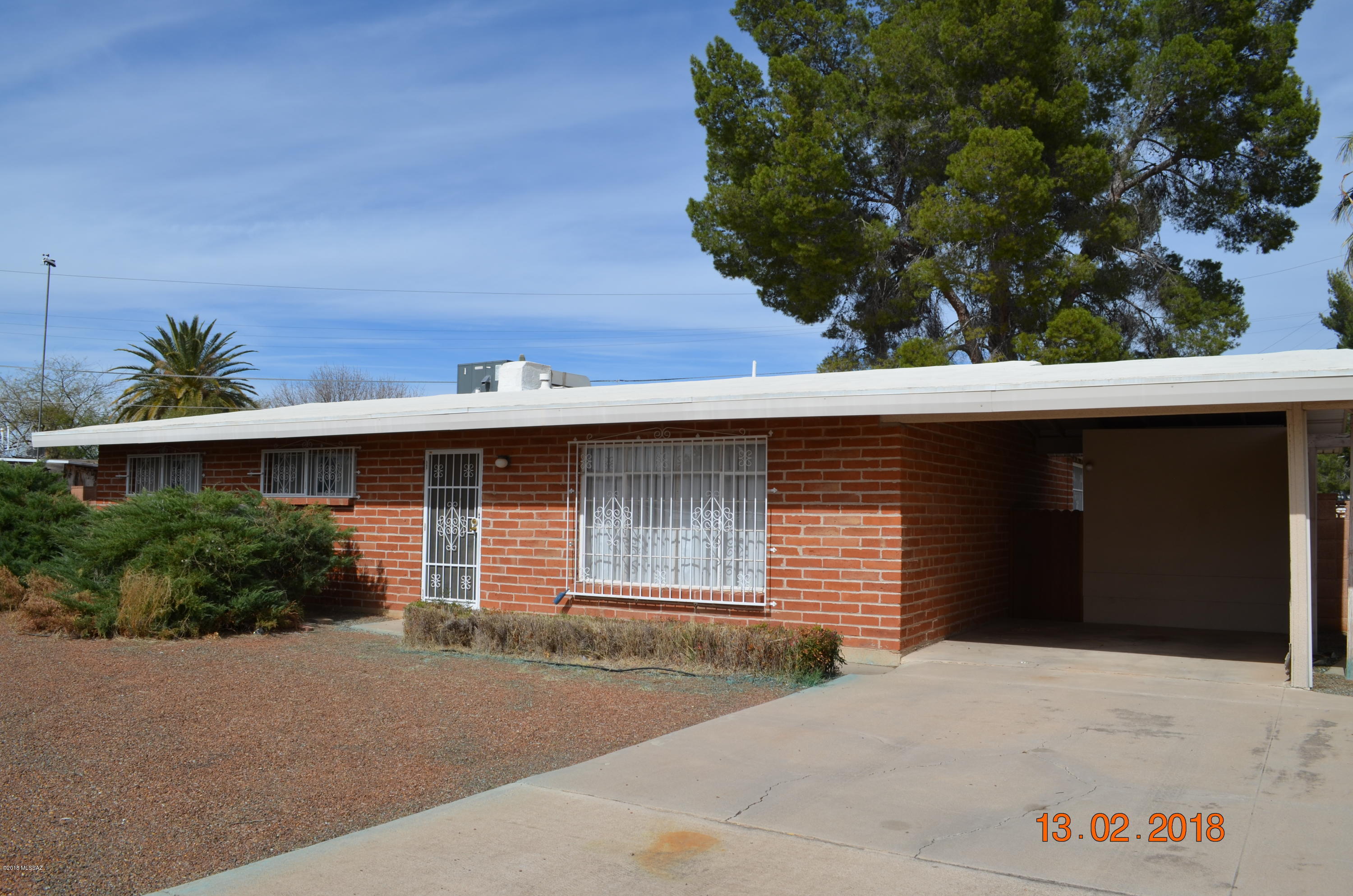 Quintessentially Mid Century Modern home (original...down to the brown double ovens, wallpaper and hallway built-ins). Bring your ideas....No crazy updates that you have to undo, sited on a large lot (.25 acre) and just waiting for your sweat equity. Turn this amazing property with good bones and a great lot into your special home. 1 block from Jesse Owens Park!  Four bedrooms & 2 bathrooms with space for a 3rd bath possible. Needs roof and cosmetic work.  Good HVAC and good sewer connection reports.  Call for your private showing now!