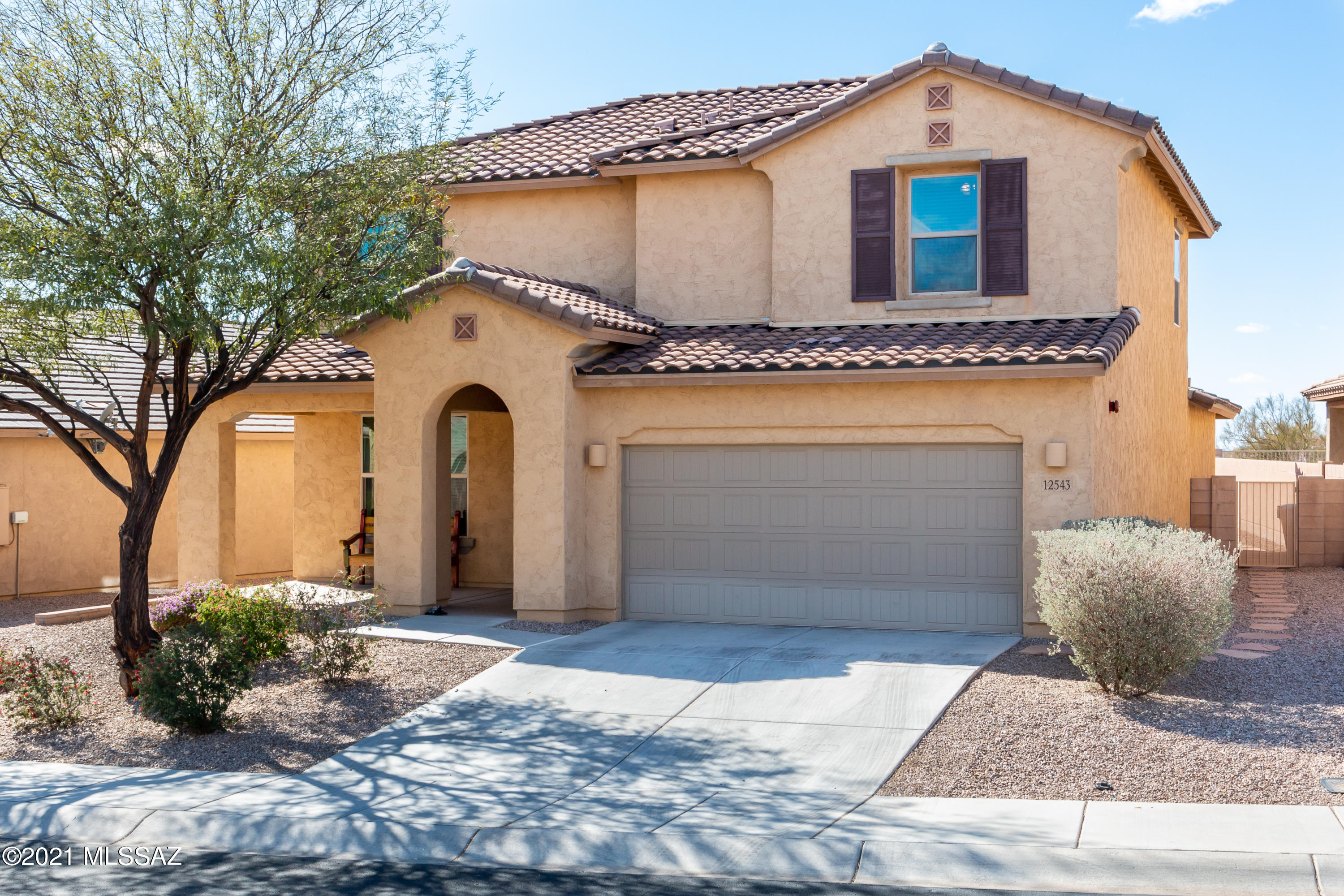 Welcome Home -Beautiful Model Perfect! Come see this 2 Story home In Tangerine Crossing, 4 Bedroom w/den, 3 bath, Loft. Open  floor plan! Gorgeous front sitting area at entrance to formal DR, Gourmet kitchen w/huge Island, tons of cabinets, granite counter tops, butler's pantry, SS appliances. Spacious great room &  breakfast nook area. Huge Den/office. Upstairs offers a spacious Loft area. Master suite offers a sitting area, walk-In closet & master bath w/dual vanities  & soak tub. Modern touches  & neutral colors throughout. Low care front yard. Entertain In the spacious backyard w/covered patio w/extended paver area w/bench seat, separate gazebo w/pavers and faux grass area. Tandem 3 car garage. Amazing mountain views!  Close to shopping, schools and  outdoor  activities.