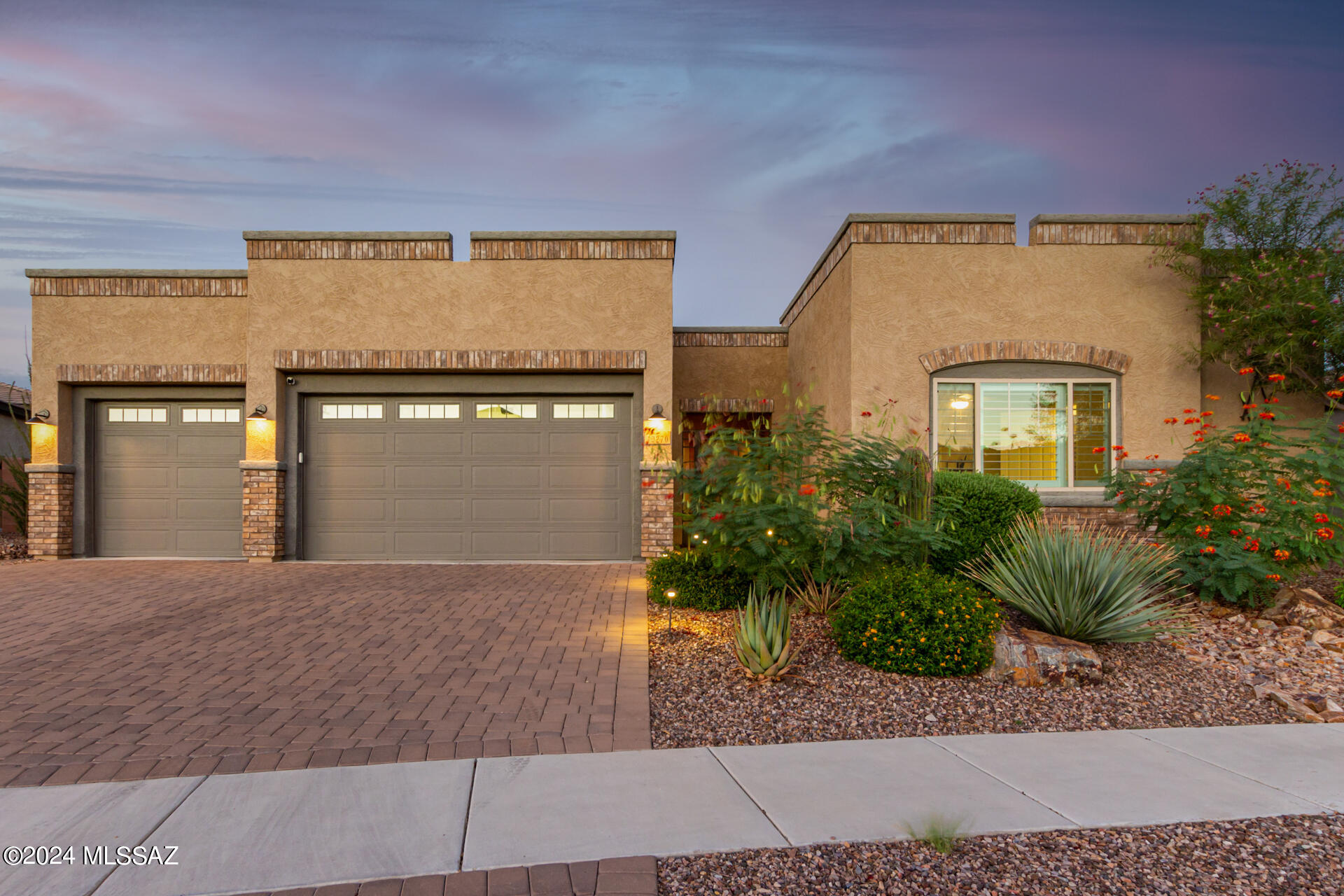 Incredibly functional VALE plan perfectly situated on a spectacular lot on wash featuring. Santa Catalina mountain views from east facing back yard. 4 bedrooms + an office +a bonus room. Owner suite has fabulous dual vanity bath, soaking tub, oversized tiled shower as well as custom his and hers walk-in closets. Laundry room with LG washer/dryer stainless steel sink and storage is adjacent to the larger walk-in closet. Living areas and kitchen are nicely appointed with wood look ceramic tile, decorator paint scheme, carpet in bedrooms and plantation shutters throughout.  Kitchen features granite counter tops with island, abundant storage, gas cook top, microwave, oven and LG refrigerator. Back yard is like a resort with pool, spa, water feature, ramada w/Lion BBQ and LV lights Owner/Agent