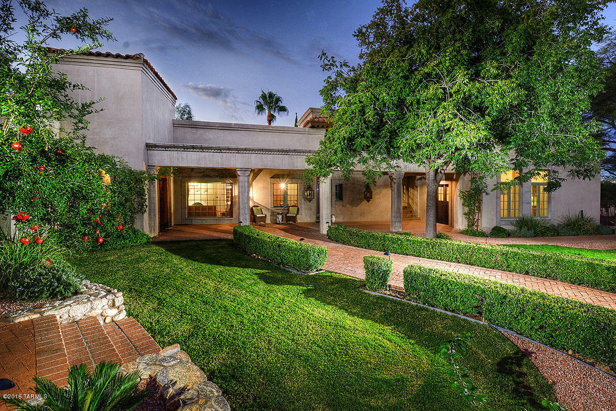 1930's era Joesler, wonderful tranquil 7569 sf home offers 7 bedrooms & 5.5 bathrooms, living, dining, family, rec. room w/theater, office/art studio, library, kitchen w/concrete counters, Sub-Z, Viking, KitchenAid, breakfast room & walk in pantry.  Stunning mix of old world design elements: wood beamed & hand glazed ceilings, Fortuny Venetia lights,12 fireplaces, hand carved doors, pillars, panels, bespoke cabinets, French doors, custom curtains, concrete, stone & wood plank floors. Separate guest suite w/kitchenette & more. Generous master suite w/luxurious Euro private bathroom. Large outdoor covered patios, loggias, pool, city & mountain views.  3 car garage + 2 car carport all on 3.72 acres conveniently located in the Catalina Foothills.