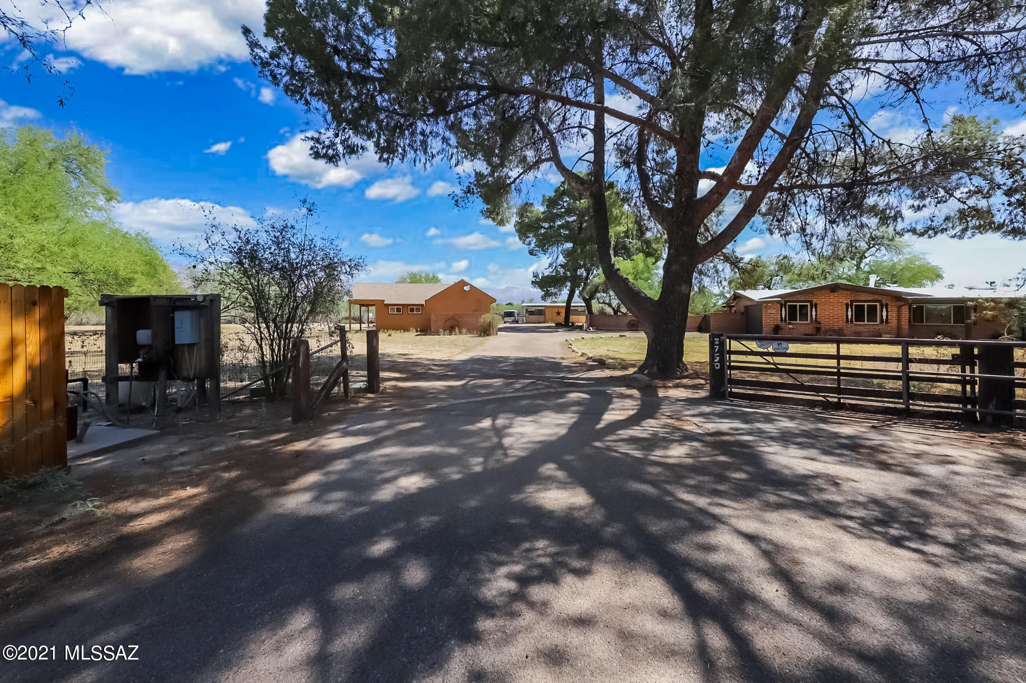 Incredible in town ranch property!  This 5 bed 3 bath property includes a 4/2 main house and a 1/1 large guest house.  The Ranch on the river boasts, open floorplan with open wood beam ceilings, great room, new concrete floors, new kitchen, new bathroom and much more.  Outside on the grounds, you will find a large patio, pool, horse barn, guest house, sport court, tall mature trees and access to the river walk.  City water and Private well.  This is truly a rare find.
