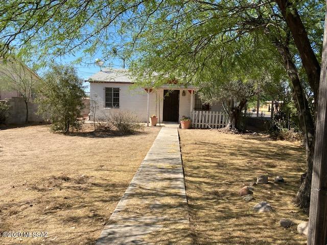 Opportunity.   2 bedroom  1 Bath main house plus  studio in the back.  Great investment.  Live in one and rent the other.   Roof redone in 2010  and Hvac on both units.  Large yard and good location.