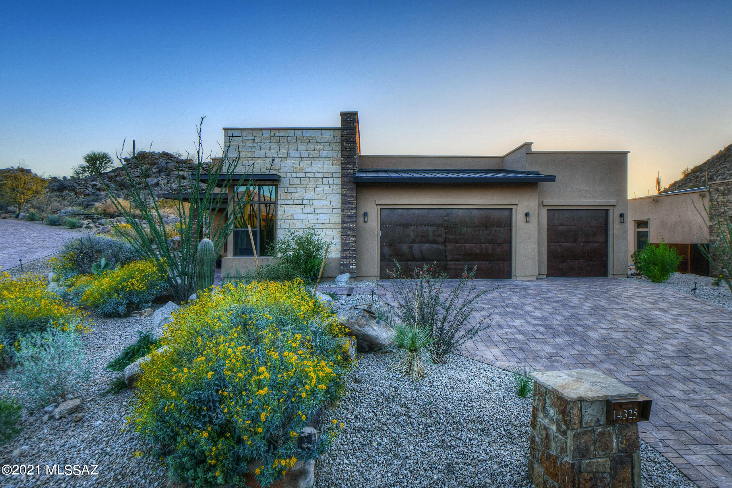 Completed in 2020! Well designed contemporary style gated Boulder Vista  in prestigious  Stone Canyon Club on a premium lot with stunning rock formations and many giant saguaros! Amazing sunrise, sunset and mountain views. This home is tastefully decorated and innovatively designed for great function and easy living, upgraded to the nth degree. This energy efficient smart home has an easy flowing split bedroom floor plan with three en-suite bedrooms, plus office with fiberoptic 5g internet.  Great Room style Kitchen with large quartz island and bar seating with views from every window. Updated with all stainless steel appliances, walk in pantry, beautiful cabinetry and custom lighting. Formal dining area is complimented by a wine room opening with French Doors, wine refrigerator additional storage for glassware and dishes. Spacious master suite with upgraded bathtub, separate shower and efficient closet system and closet island designed by California Closets. Covered wrap around patio with easy access from dining area and living room, motorized shades inside and out. Professionally landscaped with zoned irrigation and controlled with internet and smart phone. Whole house water filtration system, on-demand hot water, updated LED lighting throughout. 3-bay garage with custom cabinetry and epoxy flooring. Please note feature list under Documents. Min. Social Membership Required with purchase: $5,000, init and $275.00 monthly