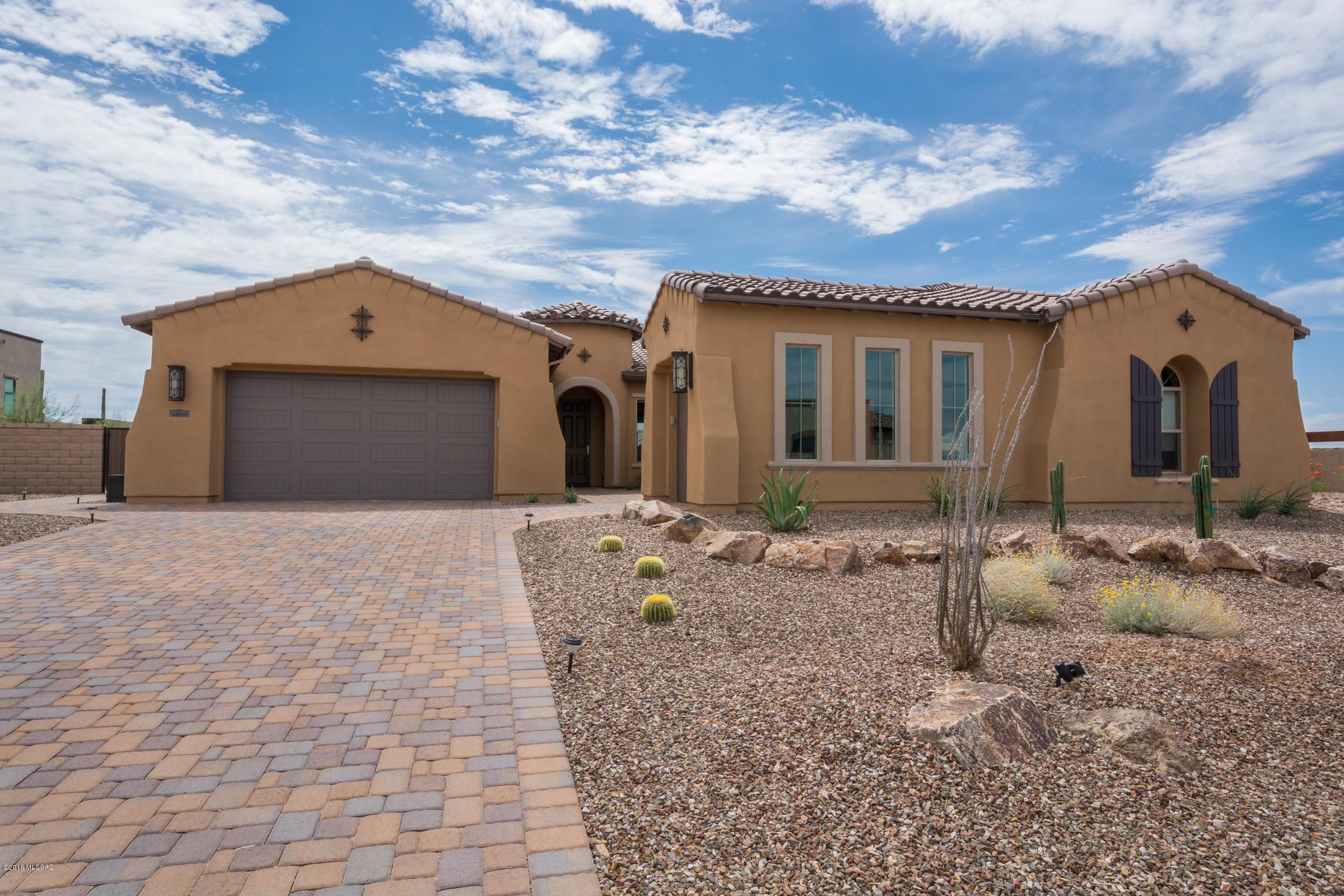 Brand new Toll Bros Escada w/ 2nd master. Best lot in neighborhood.  Backs to common area and golf course common area. No neighbor on one side and open in back. No golfers or golf balls.  Magnificent views of Catalina, Tortolita, and Tucson Mtns.  Porch faces east.  Loaded with upgrades and options.  Spectacular Mezzo 60 inch  Linear fireplace in great room with porcelain refactory. AC and most window shades set up for wifi control. Beautiful split bedroom plan w/ great room and wonderful kitchen.  Expanded pantry. Upgraded flooring, counters, and tile.  Light shelf in great room and master.