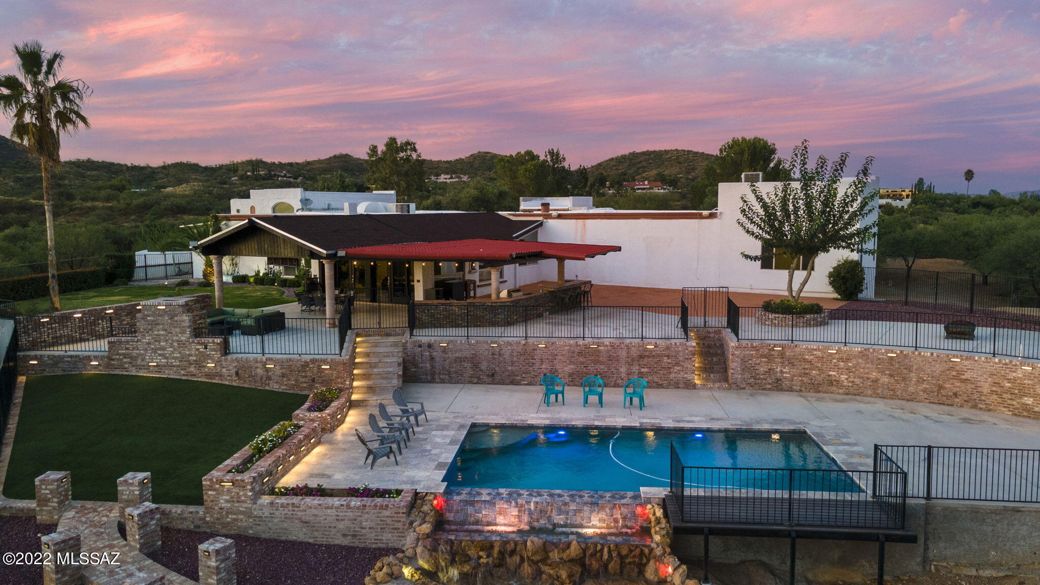 A beautiful luxury home in the heart of the Exclusive Vista Del Cielo neighborhood. With 4 bedrooms & 4.5 baths, there plenty of room for friends and family. This home sets on a 4.16 acre lot overlooking the City of Nogales with views that seem to go on forever. This home features a large family room and TV room as well as a new master suite and master bath. This beautiful estate is perfect for entertaining and has plenty of space for elegant dinners or large gatherings. Once you step outside you will find a large covered patio, barbecue area and gorgeous swimming pool along with a beautifully landscaped yard.There is plenty of room to park RV's and in addition there is a separate storage building for all of the items you need to keep out of sight and out of the elements.5 yr roof warranty