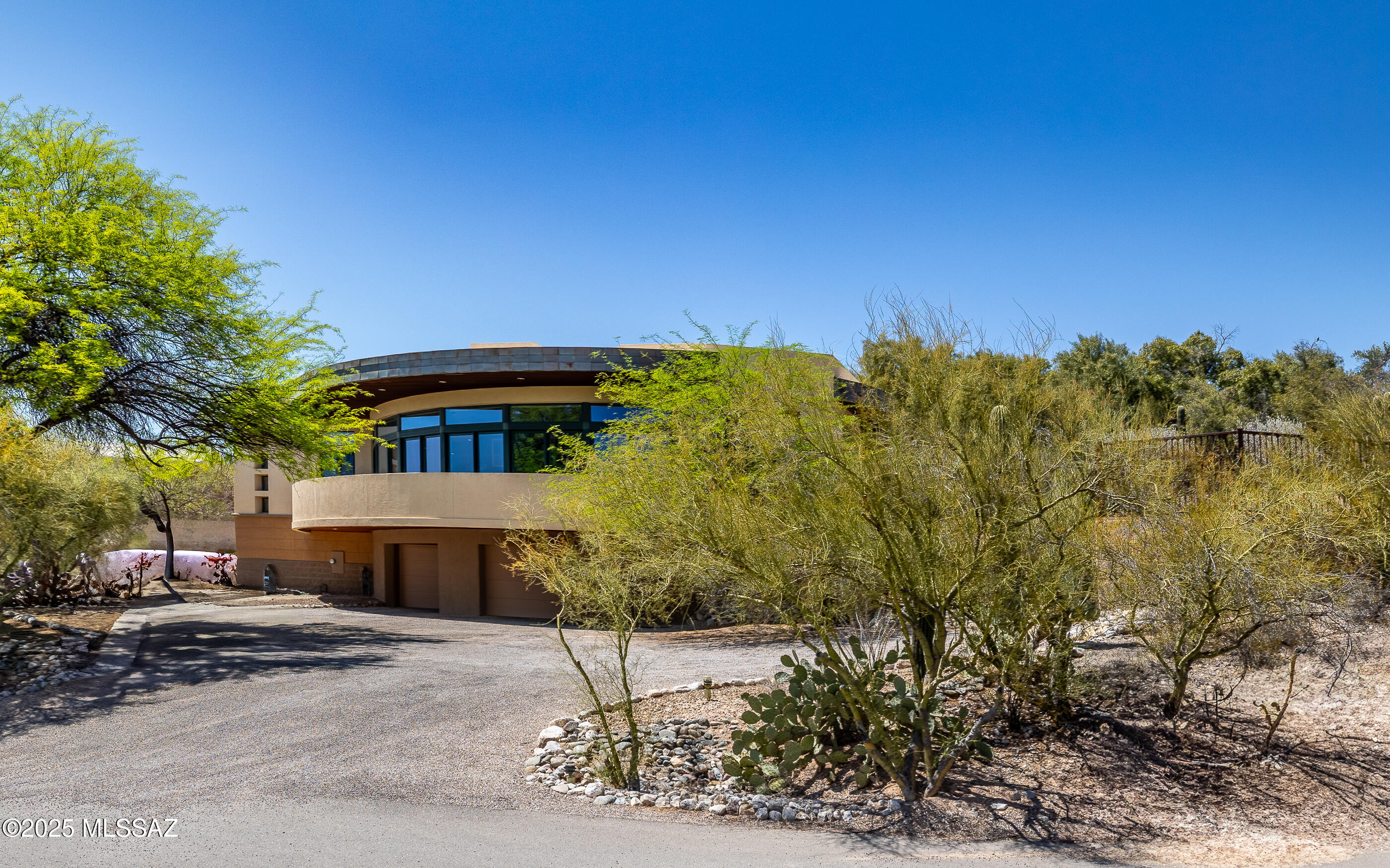 Spectacular Contemporary w/walls and walls of great room windows gazing out to panoramic city light and nature views. Beautiful custom cabinetry, wood floors, stone, rich features throughout. Gourmet kitchen w/stainless steel appliances. Grand great room w/relaxing fireplace and one of the most stunning warp around porch.  Relax in the sparkling pool or under a deep cozy, private porch. Sprawling home with many private retreat areas. Nested in heart of the Foothills - near everything yet hidden in privacy.  Call for private showing.