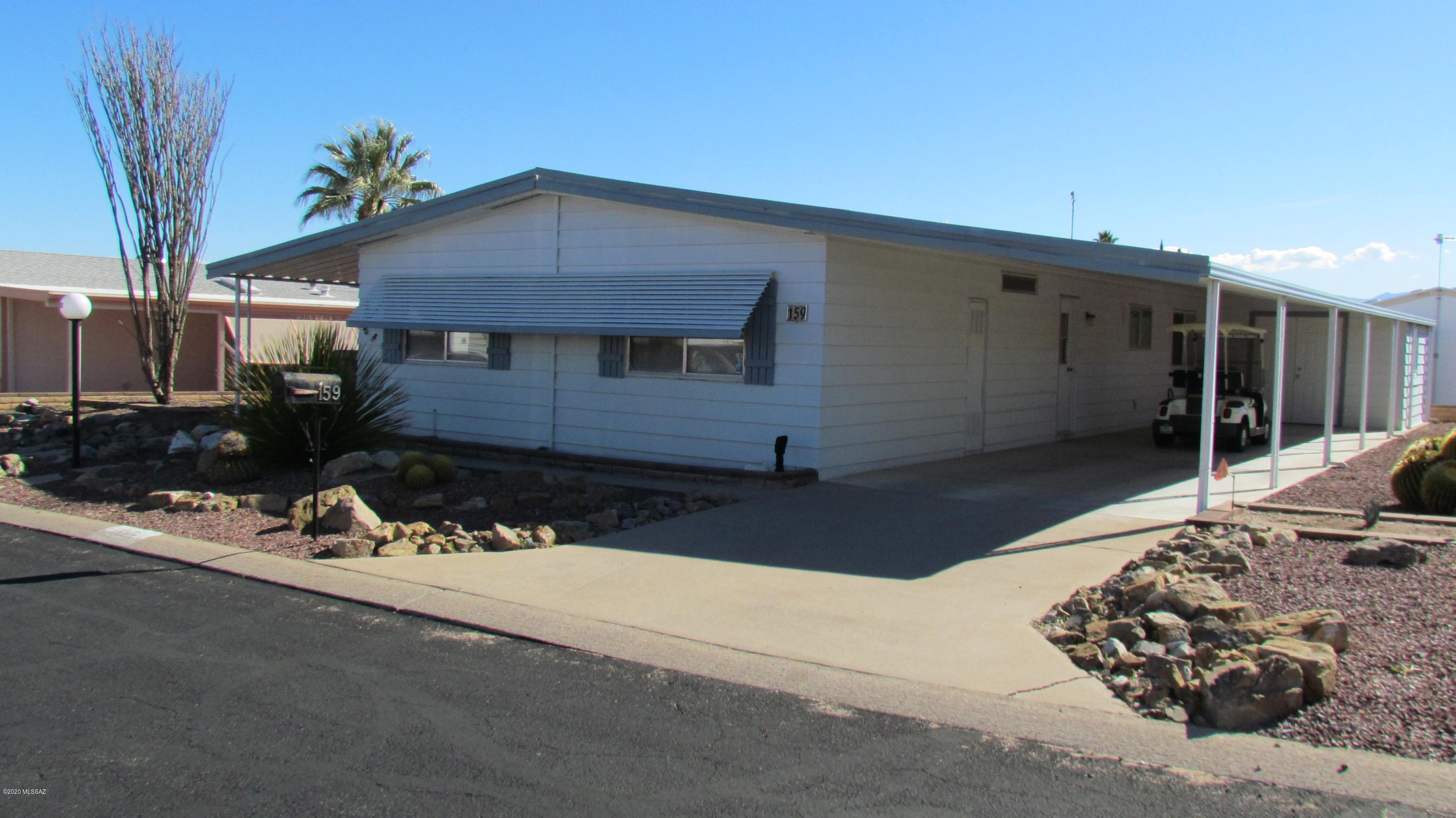 Well maintained 3 Bd 2 bath home with large Az room with MT views. Living room, Family room, split bdrms Heating & Cooling replaced 2013, roof re-coated and reparied 2017, all plumbing under home replaced in March 2020. Furnished plus 2007 Yamaha Gas Golf Cart. Shed with work sink & Double doors to drive cart in to store. Front & rear covered  patios
