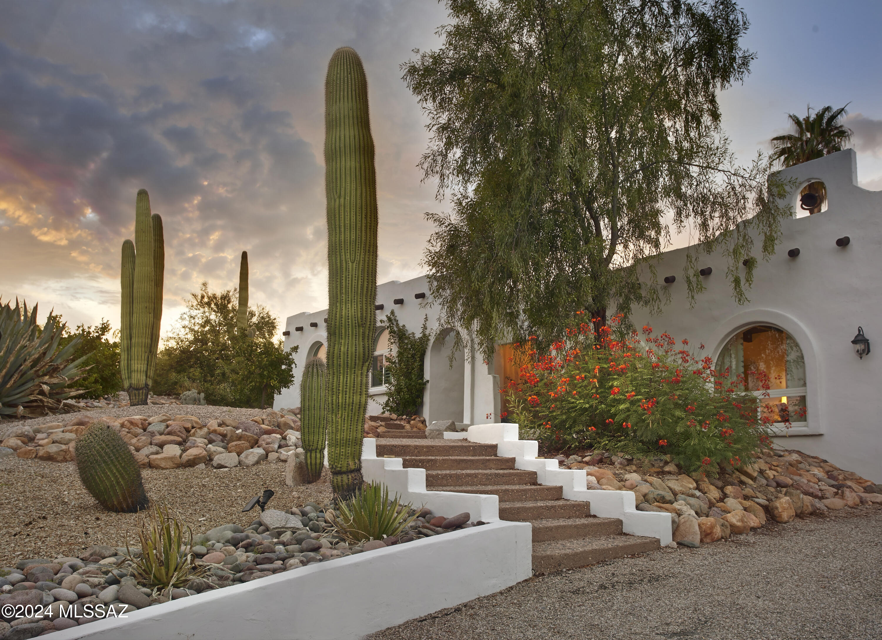 Situated on an elevated lot, set back from the road in La Buena Vida Estates, 5601 E Camino Del Celador exudes authenticity and desert charm. The experience is one that feels tucked away, yet city amenities are nearly immediately accessible. Just shy of an acre, the lot provides a generous desert buffer from neighboring properties, with views of the Catalina Mountains from the north facing backyard. A beautiful arched entry welcomes residents into a home that feels warm and comfortable. The 2,169 sq ft floorplan includes 3 bedrooms, 2 full baths, an office, separate laundry & powder room. Original wood ceilings and a wood burning beehive fireplace maintain character, while more recent improvements provide a blend of form and function. The garage is extended in height providing both overhead storage and a separate storage room.

Desert life is fully experienced outdoors where there are a variety of areas to spread out and enjoy at different elevations. The recently refinished swimming pool is complemented by two new pergolas that provide shade and cast lovely shadows as the sun sets.

This location offers incredible convenience to enjoy everything that Tucson has to offer. Access to "The Loop," a 135-mile paved multi-use path is only a mile walk or ride, but also includes a parking area. Within a mile there are robust school options, including BASIS North, The Gregory School and Castehill Country Day School. Within that same 1-mile radius you will enjoy access to Whole Foods, Natural Grocers, a pharmacy, bank, fitness facilities and various retail shops. TMC is 8 minutes, Sabino Canyon is 9 minutes, and the University of Arizona is under 20 minutes.