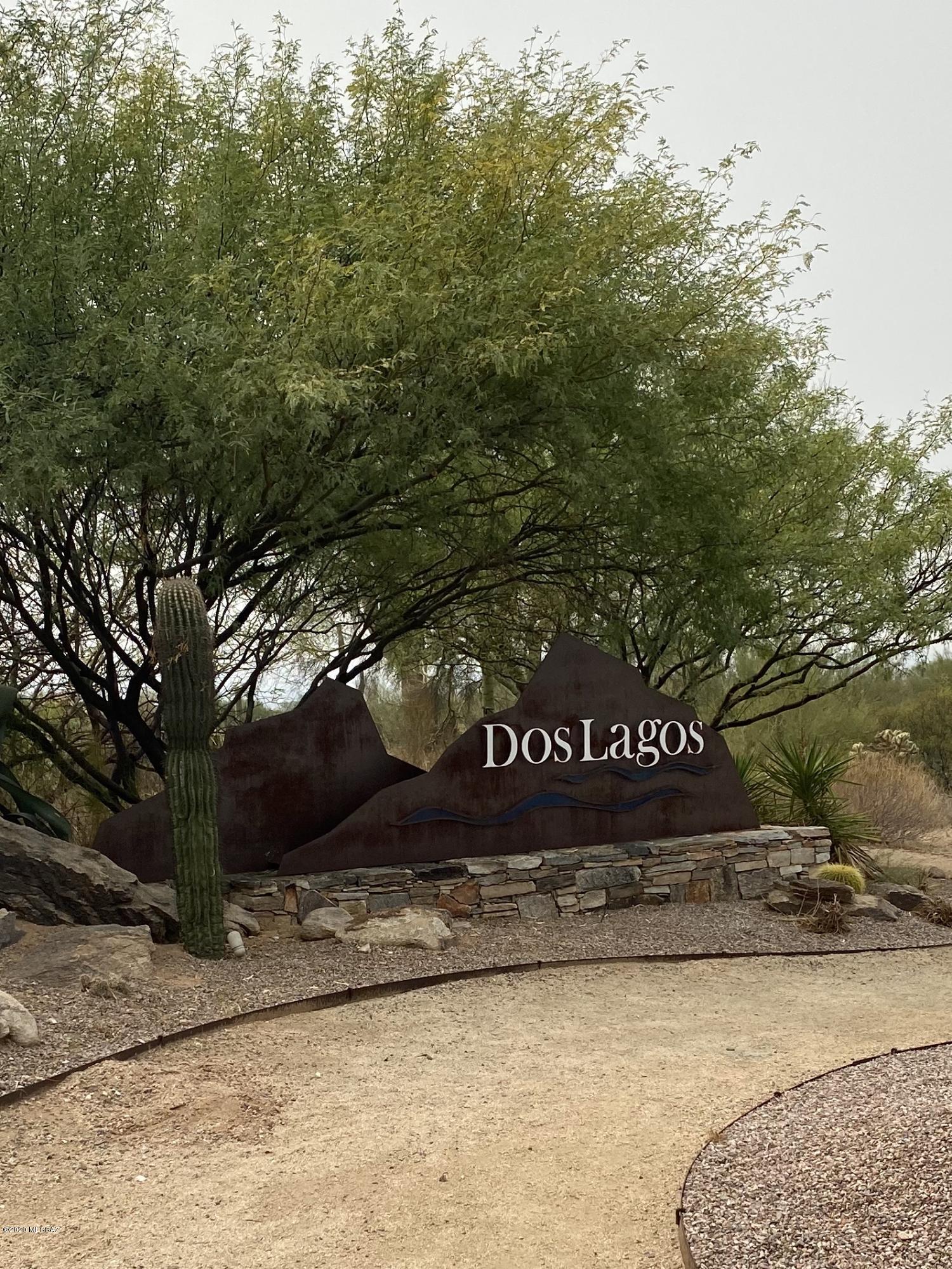 Located in the highly desirable Gated Golf Course Community, Dos Lagos at Dove Mountain. Stunning Semi-Custom Home on Large Lot. The resort like backyard is extremely private and peaceful and looks out at the desert common area. This private oasis is beautifully designed with a pool and spa that has a sun deck, waterfall and fire pits. In addition, an outdoor kitchen with bar, grill, searer and mini fridge. The deep, extended covered patio with a mister system makes it easy to enjoy outdoor living, backyard faces south and this patio shaded all day while the pool gets the sun. The kitchen has been completely redone and showcases hickory cabinets with soft closures, a farm style sink, beautiful quartz countertops highlighted by tile backsplash that ties the room together. An additional pantry cabinet was added, featuring a unique storage system allowing it to hold as much as a walk in and way more organized! French door refrigerator and new dishwasher. The generous sized bedrooms each have there own full bathrooms. Recently custom painted interior.  Beautiful custom made knotty Alder interior doors. The recently enclosed courtyard gives another area to enjoy the views of the mountain in the afternoons or mornings, it is secure, totally irrigated for plants and has electricity for lighting, both gates were custom made.The office has custom built in wooden bookcases. The office and the sitting room/front room have solid wood custom built shutters. Large Laundry with cabinets and counter space. Ideal Dove Mountain location surrounded by the Gallery North and South Golf Course and adjacent to world class Ritz Carlton Resort and Golf Club. Enjoy the many hiking and biking trails in the area. Close to the freeway and the Outlet Mall.