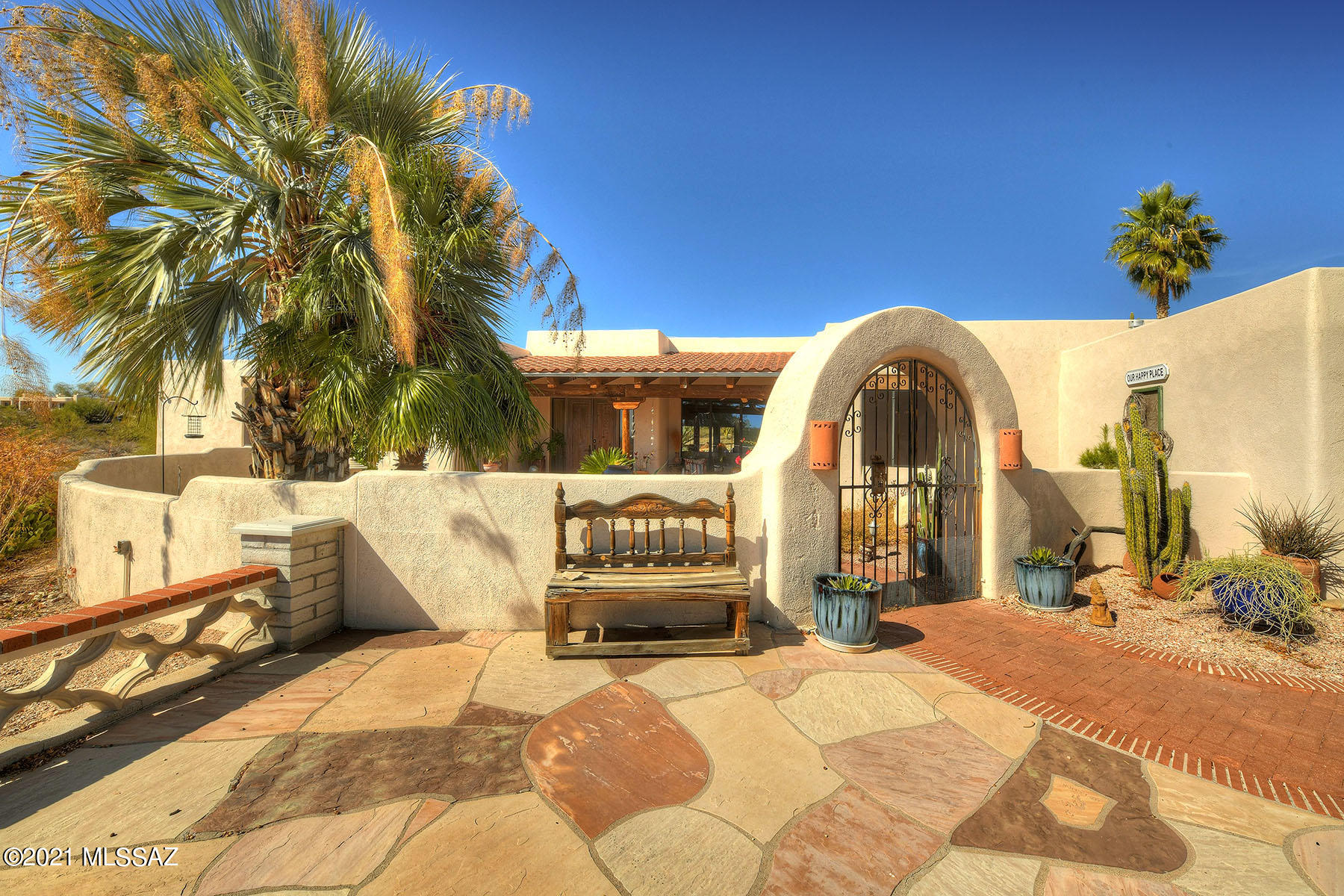 Well built southwestern design 3bdr 4ba plus office. Home on corner cul-de-sac lot.  3428 sq ft. Hi ceilings w/latillas and viga beams. Very open comfortable floorplan. City views from floor to ceiling windows & from din rm, office & 2nd bdrm. Designer Kitchen counters w/black leathered granite & natural edges. Black SS appliances.  Roll out shelves. Gas cook top, dble ovens, micro wave. New HE washer/dryer. Custom interior doors. 2 fireplaces (one in great rm and one in master bdrm.) Master bath updated. Zoned AC & heat. 2 water heaters. Sun shades on all windows. New roof & exterior paint  in 2020. Spacious 3 car garage w/workshop & abundant storage. All storage cabinets w/roll out shelves .Gated entry crtyd. Front & rear covered porch. Pool.
ENTER 2ND DRIVEWAY FOR EASY EXIT.