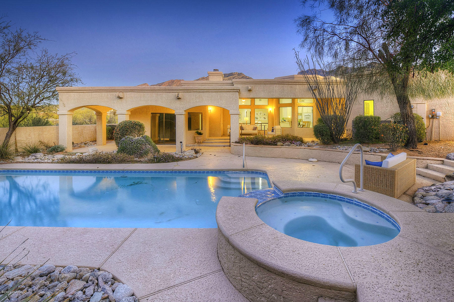 Excellent 5 bedroom, 3 ½ bath, 3 car garage home on a 1.04 acre corner lot with pool and spa in Cimarron Foothills Estates with Catalina Mountain views.  With 3,954 sq. ft., circular paver driveway leads to foyer with wet bar, grand living room with wood laminate floor, walls of windows and mountain views, fireplace and formal dining room with soaring ceiling and walls of windows.  Spacious kitchen/family room offers center island, Corian counter tops, generous cabinetry, pantry, breakfast nook and 20' X 14' family room with fireplace.  Gracious master suite has walk-in shower, dual vanities, dual walk-in closets, garden tub and master fireplace.  Expansive front and rear patios and yards, mature vegetation and so much more.