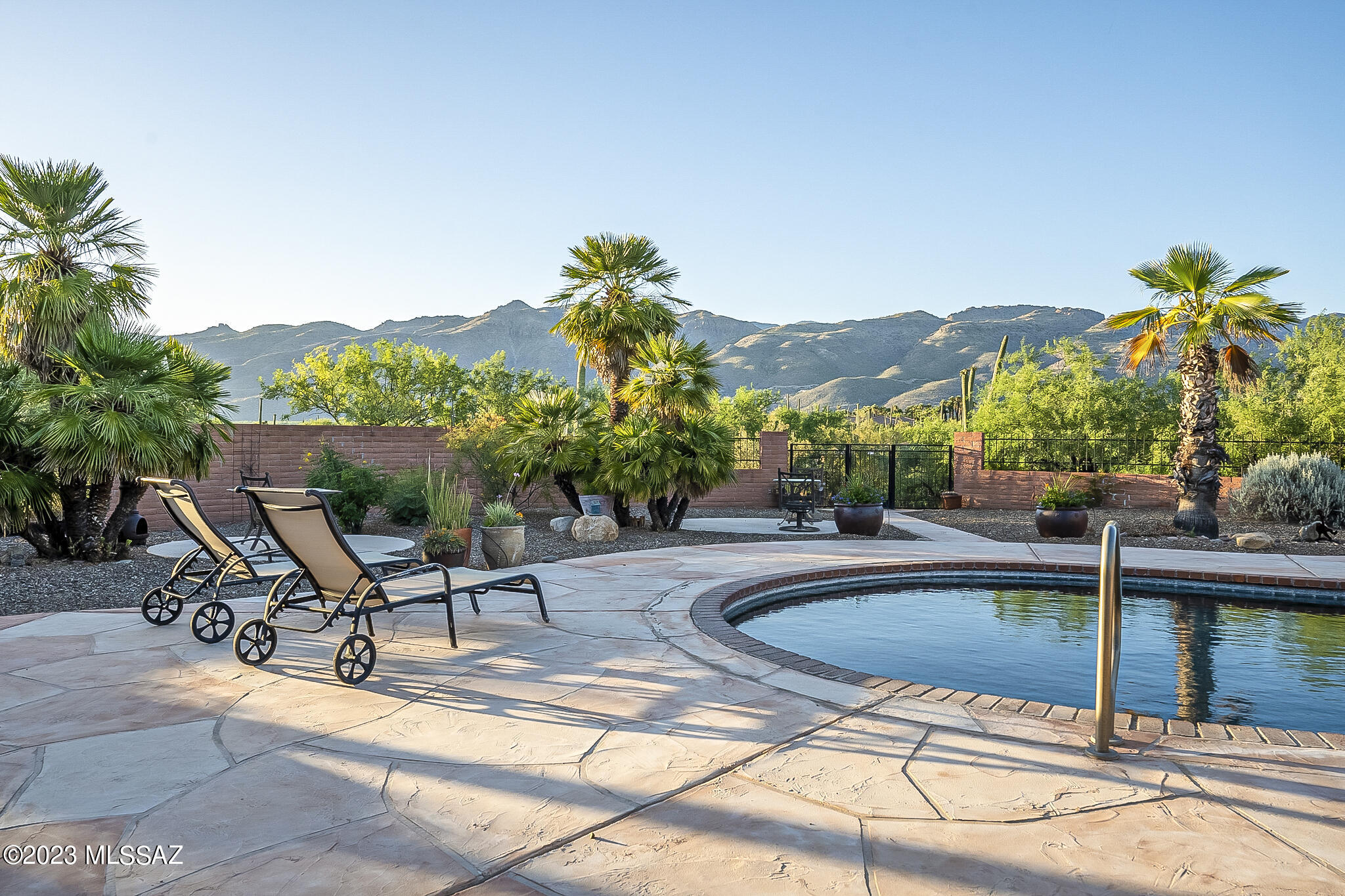 Elegant Updated Hacienda Estate on nearly 4 acres of horse property.  SPACE, PEACE, TRANQUILITY and ULTIMATE PRIVACY. 4 BR 3 BA in 2587 sq ft. PANORAMIC views of the Rincon and Catalina mountains. City views as well! Resort pool and patio with exceptional privacy. Barn with large tack room and three box stalls, water and electric. Barn could be reimagined as a guest house. Large dressage/turn out arena. Covered area for RV. Two large sheds. Two water harvesting systems, one which can fill the pool. Custom cabinetry and custom concrete countertops throughout kitchen and bathrooms. Roman tub. Concrete flooring. Walk to Aqua Caliente Park or ride to the washes. Commune with nature here! These properties are not often available. An absolute Must-See oasis.