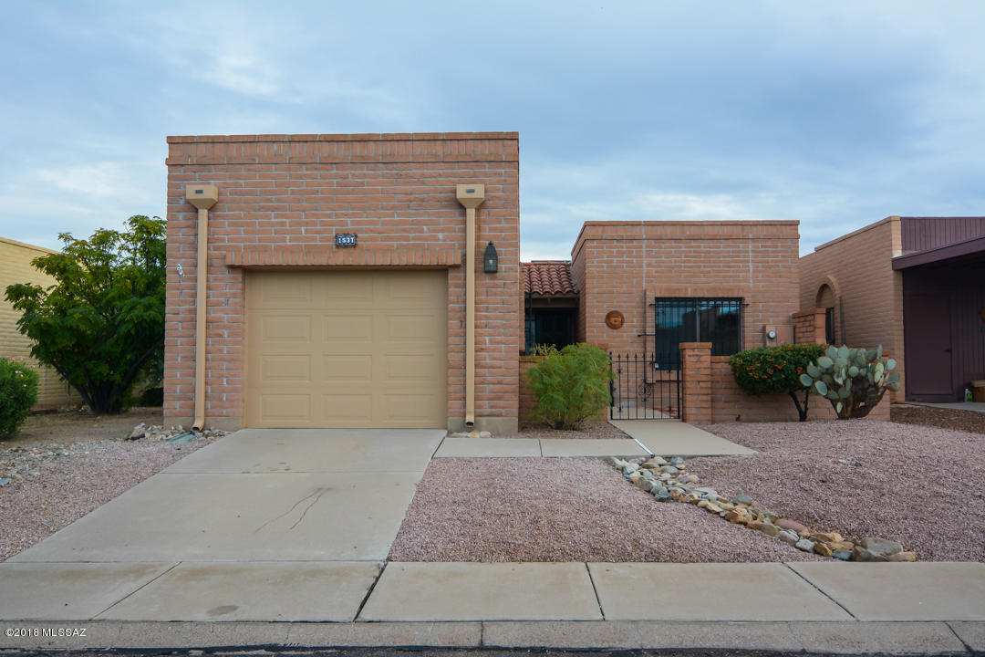 Beautifully remodeled Town Home. Located in a convenient Green Valley location. Rich earth tone ceramic tile. Nice modern kitchen with new SS appliances. New granite countertops. New custom interior paint. Walk in closet in master bedroom. One car garage. Mature vegetation. Upgraded door hardware and light fixtures. Covered back porch. Beautiful mountain and desert views. This home shows beautifully.