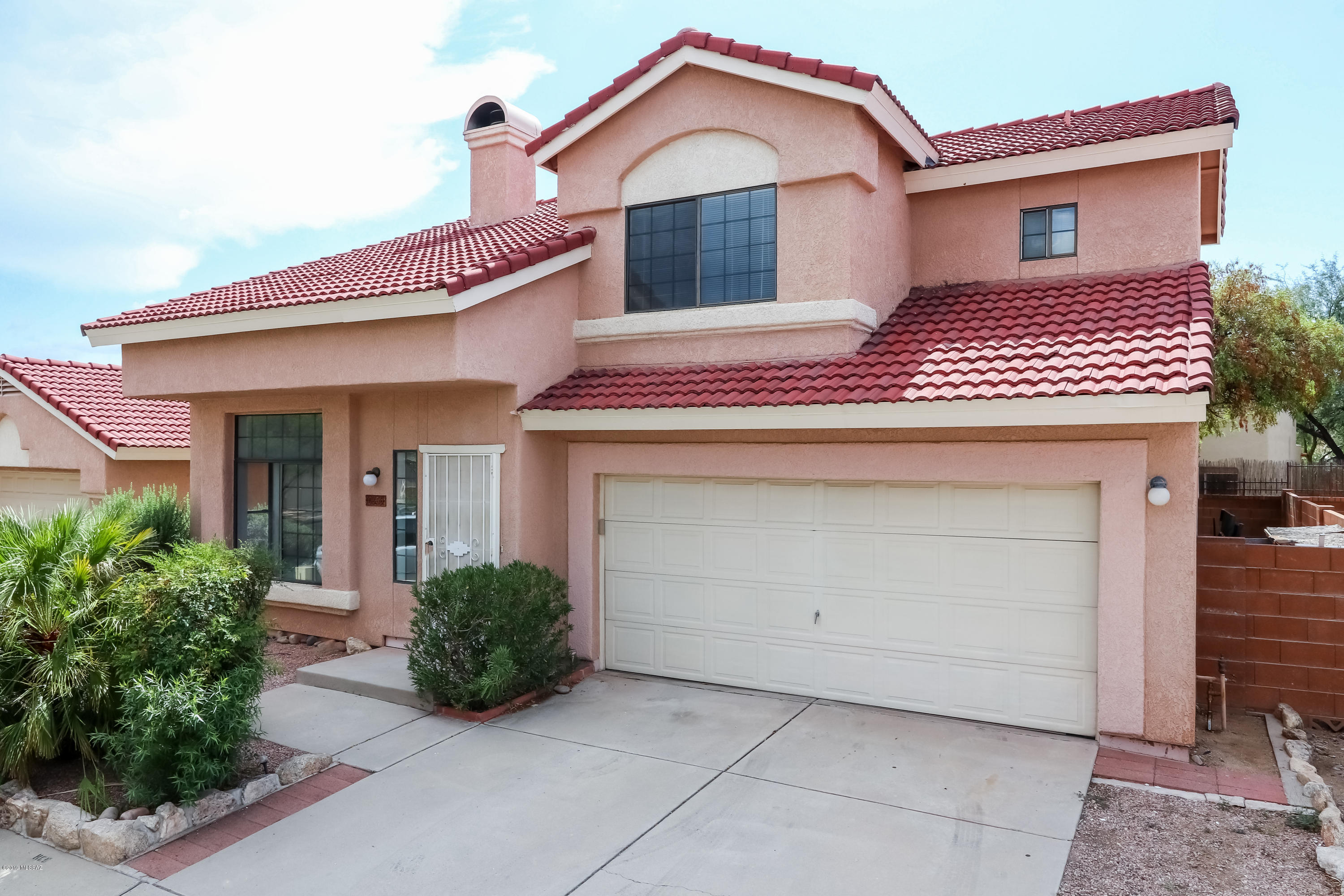 Seller to entertain/counter offers between $215k-$235k. Delightful Oro Valley home in a prime location & a short walk to Riverfront Park. Enjoy gathering with family & friends in the generously sized, light-filled living room graced by beautiful vaulted ceilings and an eye-catching double-sided fireplace. On the other side of the fireplace, a cozy family room opens to a bright kitchen with new flooring &  a dining nook with a large bay window overlooking the tranquil, shady backyard. The upstairs owner's suite with vaulted ceilings makes the room bright and open, and features a private bath with garden tub, separate shower, and double vanity. Home is poly-free! Great outdoor space with mature shade trees offers comfortable covered patio perfect for entertaining. Investment property in the heart of Oro Valley.
