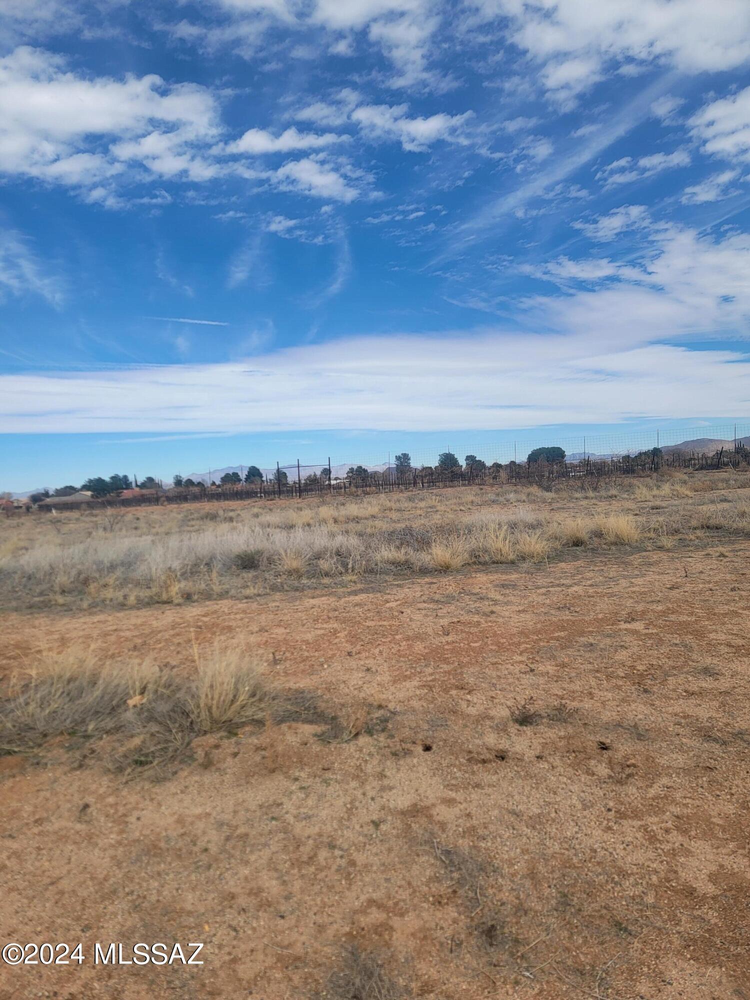 Build your dream home on this residential lot in the village of Sunsites. Good surrounding views. Fiber optic Internet. Paved Street. Clear Springs Utility ,Power, water and sewer along the front of the lot. Ready to build on. Frame built only. No manufactured homes.  New vineyard behind back property line. Views of Dragoon Mtns from the lot with amenities in the village, but easy access to Hwy 191 and I-10. Sellers are MOTIVATED!