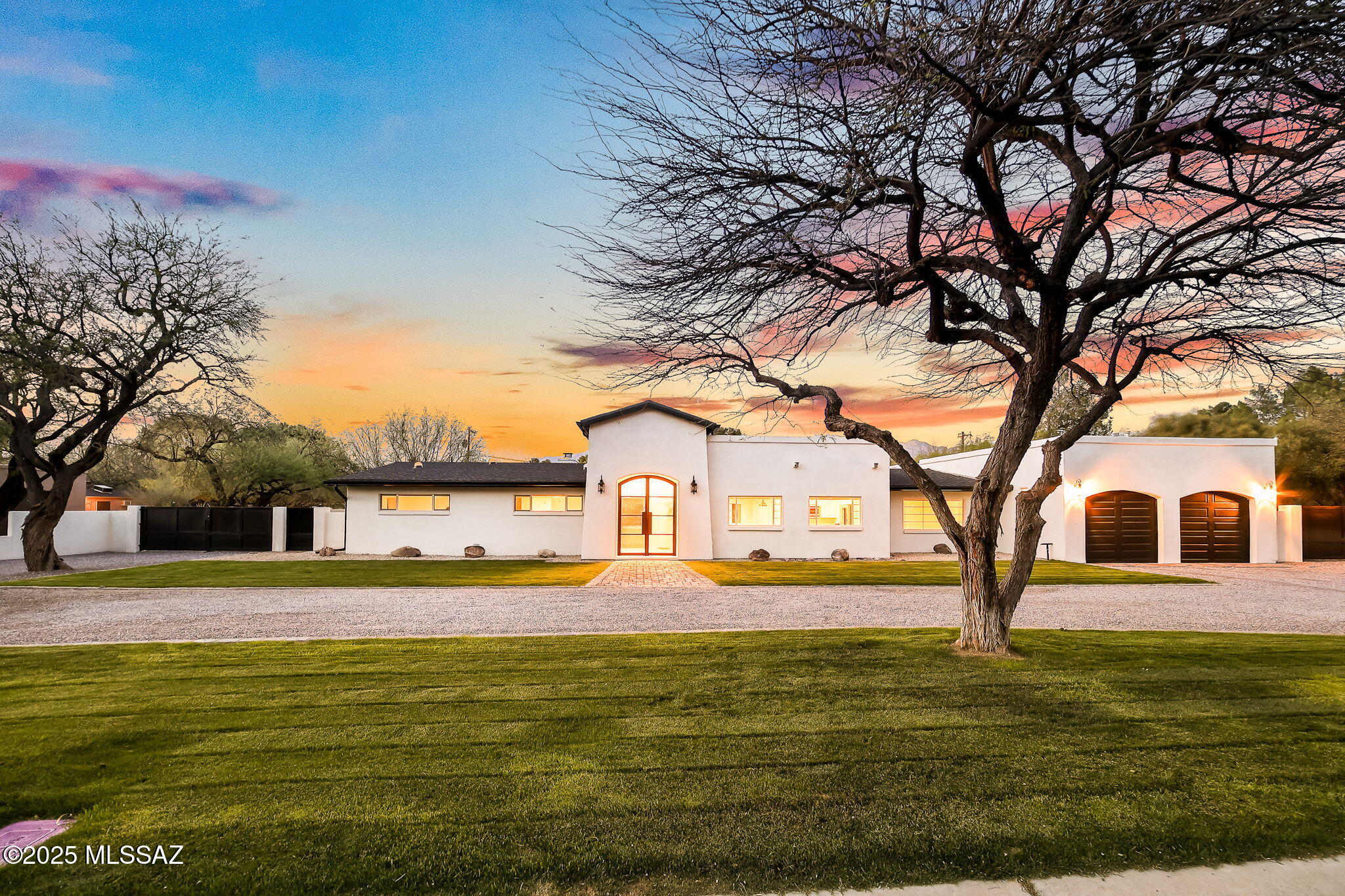 Welcome to an unparalleled oasis of comfortable elegance and grandeur set within the prestigious guard-gated community of Tucson Country Club! This one-of-a-kind estate transcends the ordinary with an invitation to luxury living at its finest. Upon arrival, enjoy enchanting curb appeal featuring a grand entrance, an artisan-crafted custom steel front door and lush manicured lawns, setting the stage for an estate that is nothing short of extraordinary!

Step inside the breathtaking foyer with vaulted beam ceilings, evoking a sense of wonder and excitement creating an immediate connection to the comfortable elegance that fills every corner of this home. Immerse yourself in the seamless blend of light-filled, expansive, open living spaces. The living room flows effortlessly into the state-of-the-art, open-concept kitchen, which is the focal point of contemporary style and functionality. Boasting a farmhouse sink, new appliances, expansive eat-in island, and an abundance of storage that promises effortless organization, this chef's kitchen will satisfy even the most discerning epicurean!

The palatial primary suite offers a level of solitude and comfort on par with a five-star retreat! Revel in the soaring ceilings, colossal walk-in closet, and a private sanctuary perfect for a home office or a tranquil reading nook. Indulge in the spa-like bathroom adorned with a deep soaking tub and exquisite designer finishes that create a serene environment for relaxation and peace!

Thoughtfully designed, this estate features a true split floorplan that crafts a dedicated guest wing with three generously sized bedrooms, each offering privacy and space for guests. 

Venture to the backyard, an entertainer's paradise showcasing a deep covered patio, a dazzling pool that shimmers under the Tucson sun, and expansive green spaces perfectly poised for recreation, framed by breathtaking mountain views. Picture the extraordinary gatherings you will host amidst this splendid backdrop where friends and fun connect! If more connection is desired, don't miss the world renown Tucson Country Club just a stroll away with 18 Holes of Championship Golf, Tennis, Pool, Dining, Social Clubs and so much more. This amenity is world class and is mere moments from home!

Additional luxurious upgrades include a new air conditioning system for ultimate comfort, a newly installed roof, the timeless beauty of Acacia wood flooring, stylish new windows, a cozy fireplace for delightful evenings, newly added gutters, and fresh exterior stucco and paint enhancing the aesthetic appeal.

This turnkey, one-of-a-kind residence offers an effortless blend of elevated elegance and modern comfort, strategically located in Tucson's most desired enclave. Don't let this magnificent opportunity pass you by! Embrace a lifestyle defined by luxury and endless possibilities. Welcome Home!