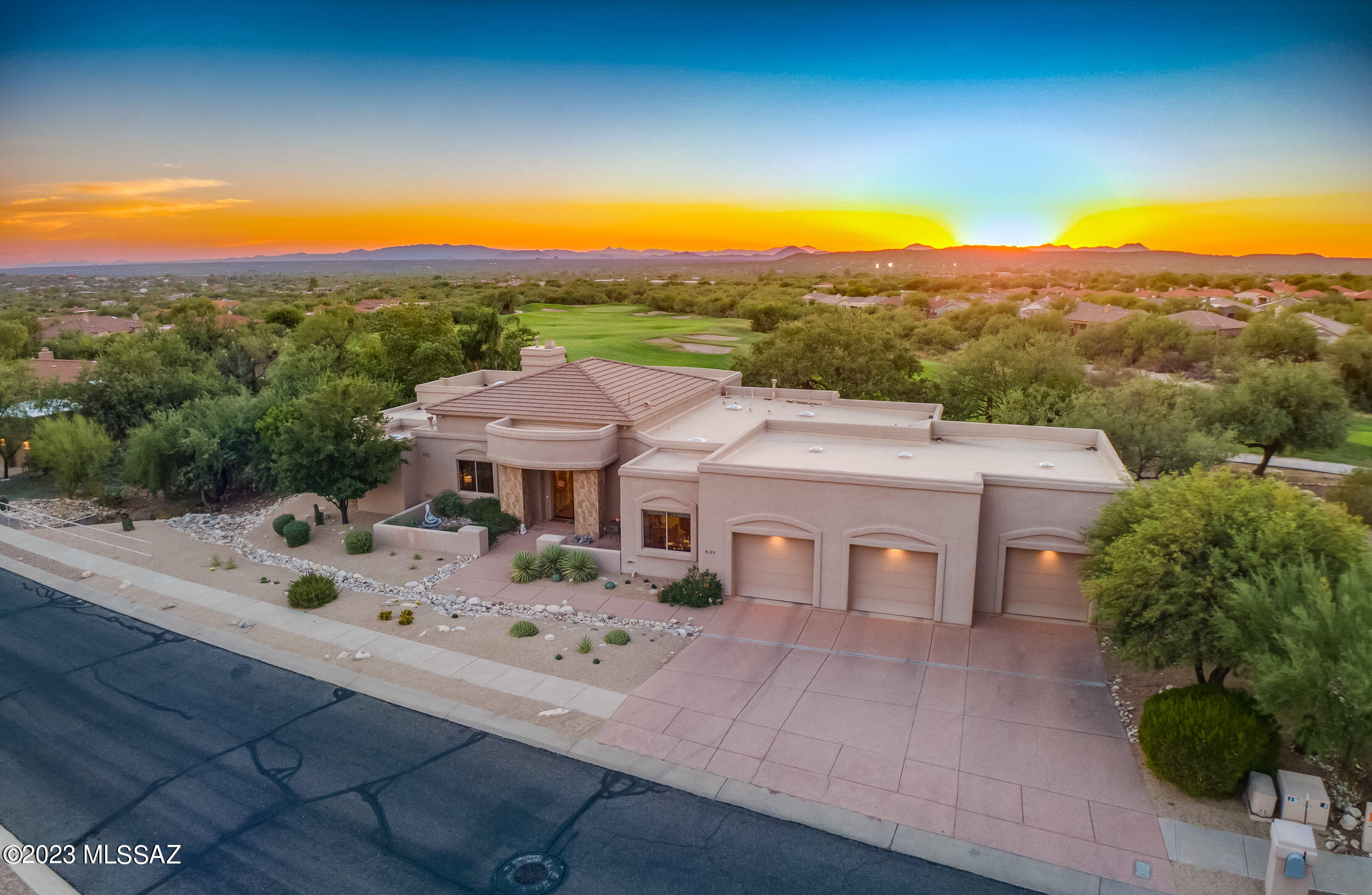 ASSUMABLE VA LOAN AT 2.25%!!! Welcome to this Spectacular Contemporary Home! Situated directly on the 13th hole of the prestigious gated Arizona National Golf Course, this home offers an unparalleled lifestyle of luxury and leisure. A true golfer's paradise, you can step out of your back door and onto the lush fairways within moments. Prepare to be mesmerized by the stunning views and unforgettable sunsets that grace this home with their beauty. Whether you're enjoying a quiet evening or entertaining guests, these vistas will undoubtedly leave a lasting impression. Inside, you'll discover a well-appointed interior with a harmonious blend of materials. Limestone slab and bamboo wood floors create a warm and welcoming ambiance.