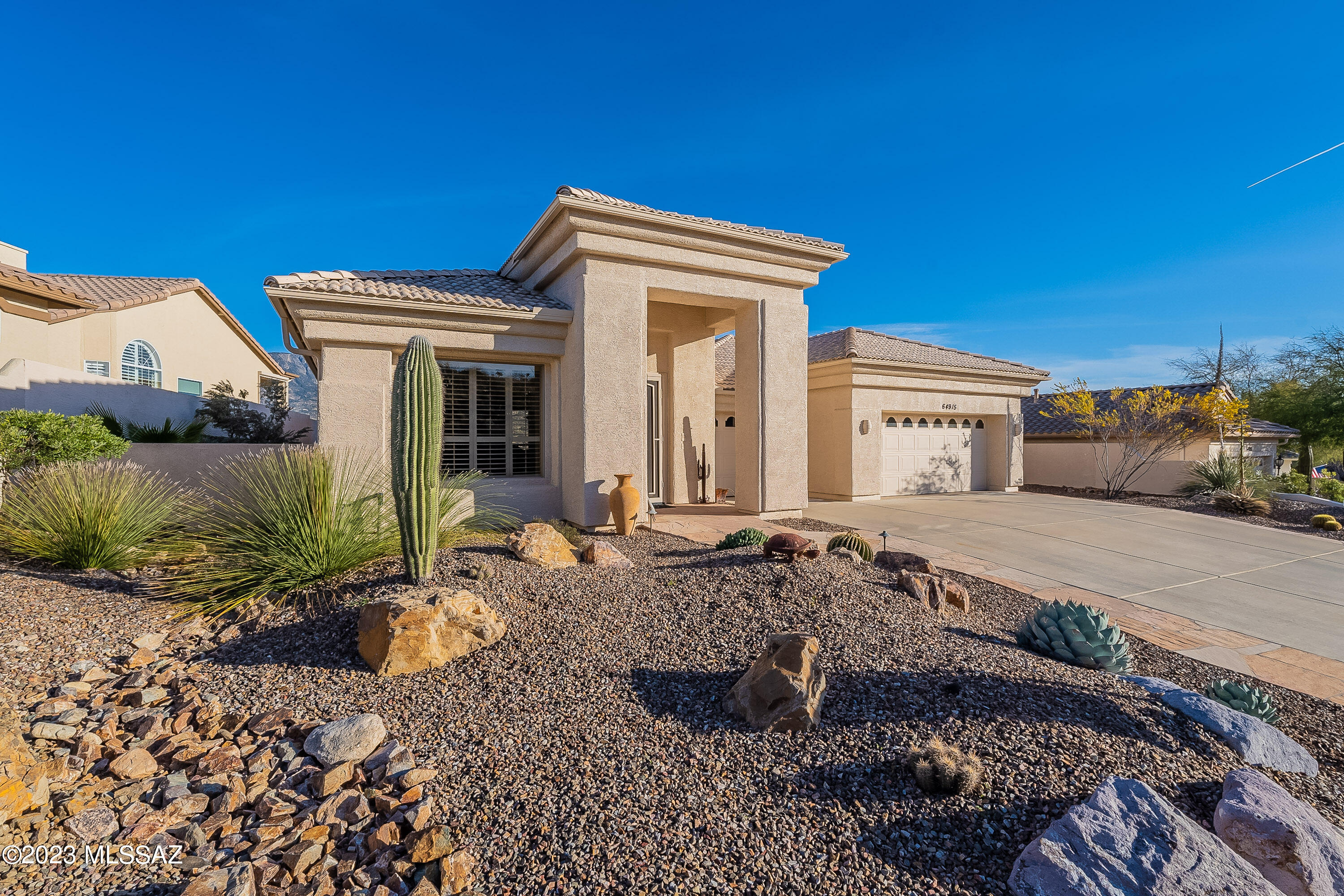 YOU CAN HAVE IT ALL! Panoramic Mountain Views abound & include Golf Course & Lake Views too! This sought after D Elevation Cheyenne features higher ceilings & 8' slider in family w/clerestory windows. Higher & deeper patio cover to enjoy the spectacular views even more! The den is off foyer & has built-ins, large window w/a view of the desert very private. Den, Living & Dining Rooms have plantation shutters. Living Room can easily be used as a Media Room due to high smaller windows. Coved Dining room ceiling adds interest to the space. Large family room features wet bar, gas, stone, centered fireplace w/automatic starter & wiring for flat screen above it. Open kitchen with cabinetry & granite counters. Kitchen has a nook & breakfast bar. There is a pantry w/pull out shelves. Owner's retreat w/double door foyer is spacious & bright. Upgraded bay window adds 25 sq. ft. to this already large room. Master Bath features split vanities, walk-in shower & soaking tub. His 'n her separate closets finish the compliment to this area. Don't forget the separate Powder room w/pedestal sink, laundry room, oversized 3 car garage, & 2 more bedrooms w/a separate guest bath between them.