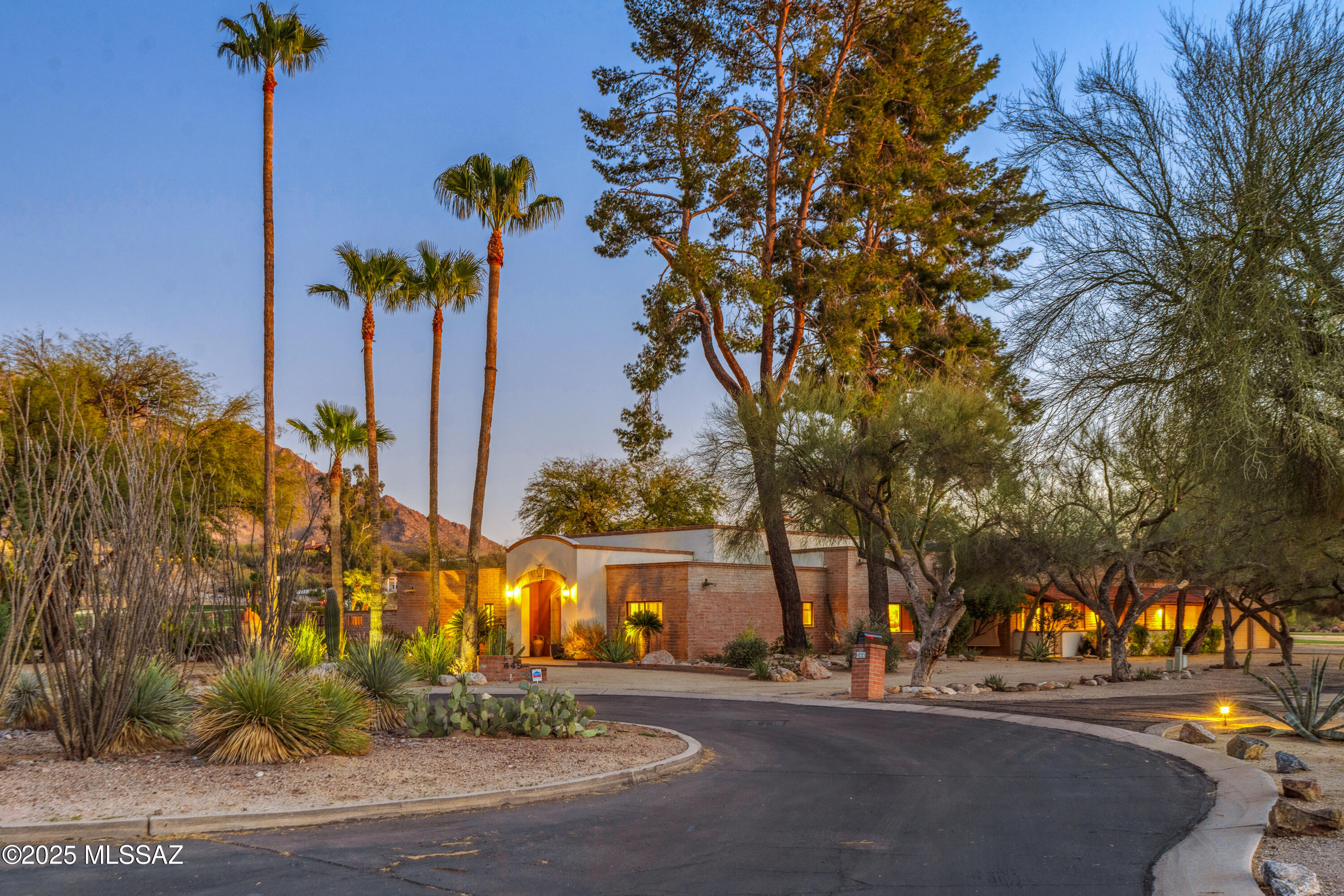 Luxurious Home with Breathtaking Views is nestled in a large, secluded, cul-de-sac setting.  The home offers over 4100sf of spacious living.  Three pairs of French doors open from the great room to the private back patio, a beautiful freeform pool, the Oro Valley CC golf course and panoramic Catalina Mountain views