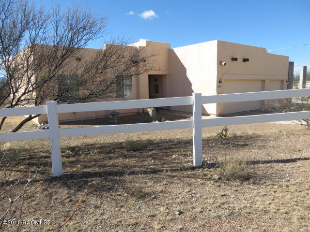 Wow, what a deal! Southwest decor interior, on over an acre with fantastic views & extended length back porch. Some decorative fencing and an RV parking slab with supports are in. Great use of windows and french door to bring the view inside. Split floor plan with owners suite at one end and other bedrooms on other side of house. Peeled post accents inside accompany the pleasing southwest colors. Oversized 3 car garage ( 693 sq ft) and don't forget that recently added RV parking slab.