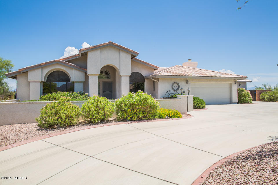 Like new custom home with all that you want...Lot sits up high to enjoy the best views of the mountains and city! High ceilings, spacious open floor plan includes formal dining, gourmet kitchen opens to great room floor plan to the family room. Stainless steel appliances, Silestone quartz counter tops, dual pane windows, copper plumbing, large ceramic tile floors, like new carpet, wood floors in 3rd room.Remodeled master bath tub & shower, plantation shutters, cozy wood burning fireplace, RV pad with full hookups, 3 car garage with workshop and cooling system, Jacuzzi tub in back yard, large covered porch in back for relaxing and entertaining. Dog run. No HOA Fees. Must see this fantastic home on 1.23 acres.
