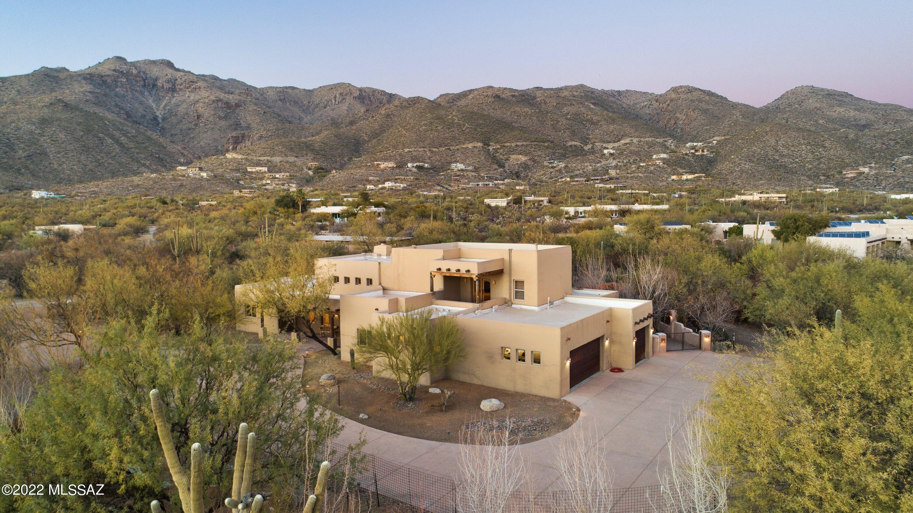 Custom built Santa Fe style 4 BR 3 BA Hacienda on 3.3 acres with views galore. Enter your private gate in the quiet Tanque Verde Valley to your desert oasis. Enjoy your Heated Pool &Spa with Water Feature and Ramada with BBQ & Fire Pit . Step inside and find True Santa FE Style Throughout. Kitchen& Great Room have Soaring Beam Ceilings and Custom Plastered Walls.  Huge Family/Activity/ Office room boasts 2 Patios with Magnificent Mountain Sunrise and Sunset Views. Property is Flat & Useable with irrigated areas for Gardening and many varieties of mature fruit trees.  Zoned for horses.  Built with 12''-24'' exterior walls for Insulation& Design.  Extra deep 3 car garage. Bring your recreational vehicles!
Water softener conveys ''as is''.