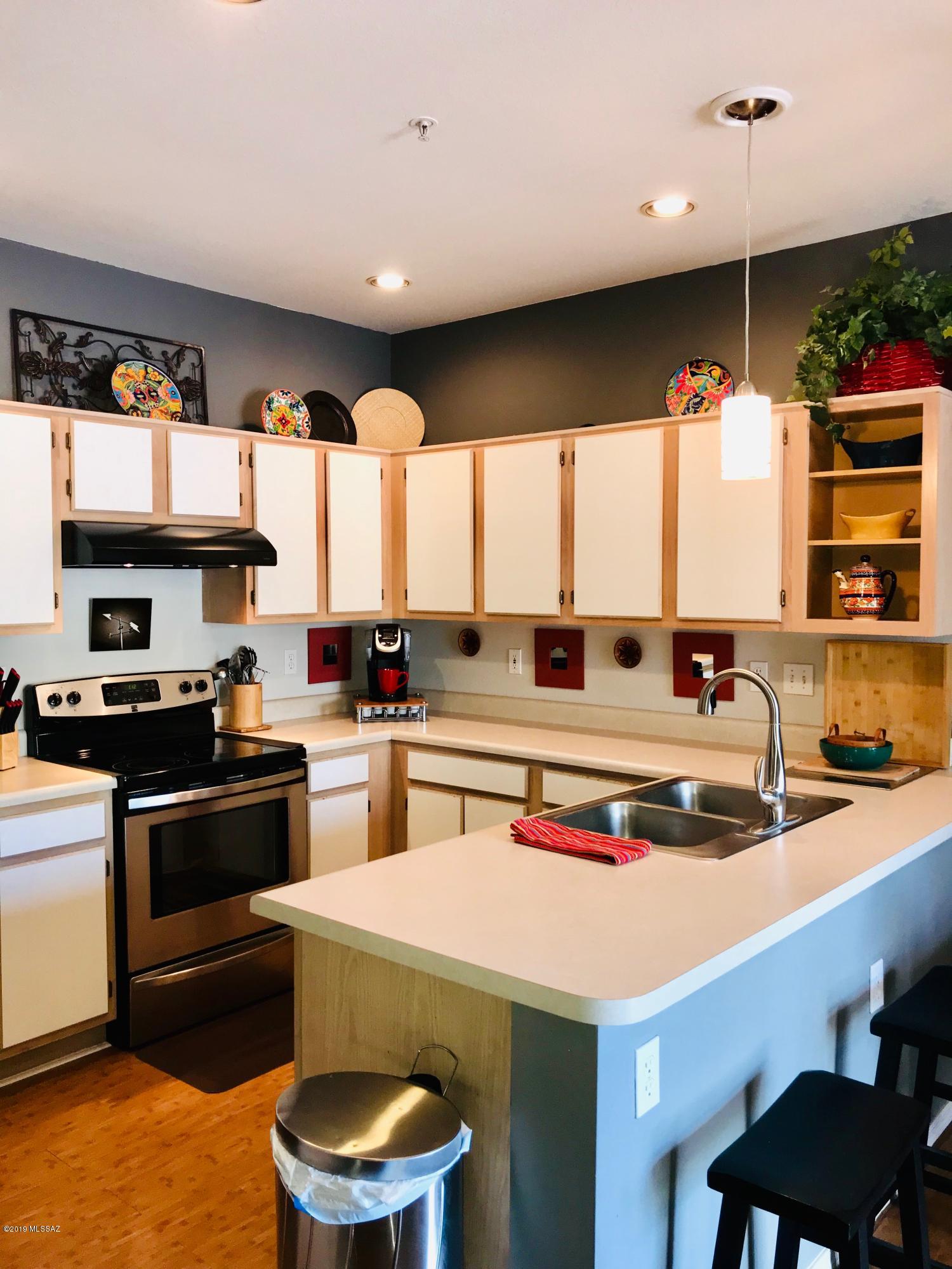 Great Location! Nearby shopping and easy access to I-19. HOA heated pool, GVR available, non-age restricted. Bright and vibrant 2 bed/2 bath with a 1 car garage and extra non-covered parking. The kitchen is spacious and a view outside from the kitchen sink. Washer and dryer in bathroom closet.  Roof re-coated in 2018. This one will go fast.