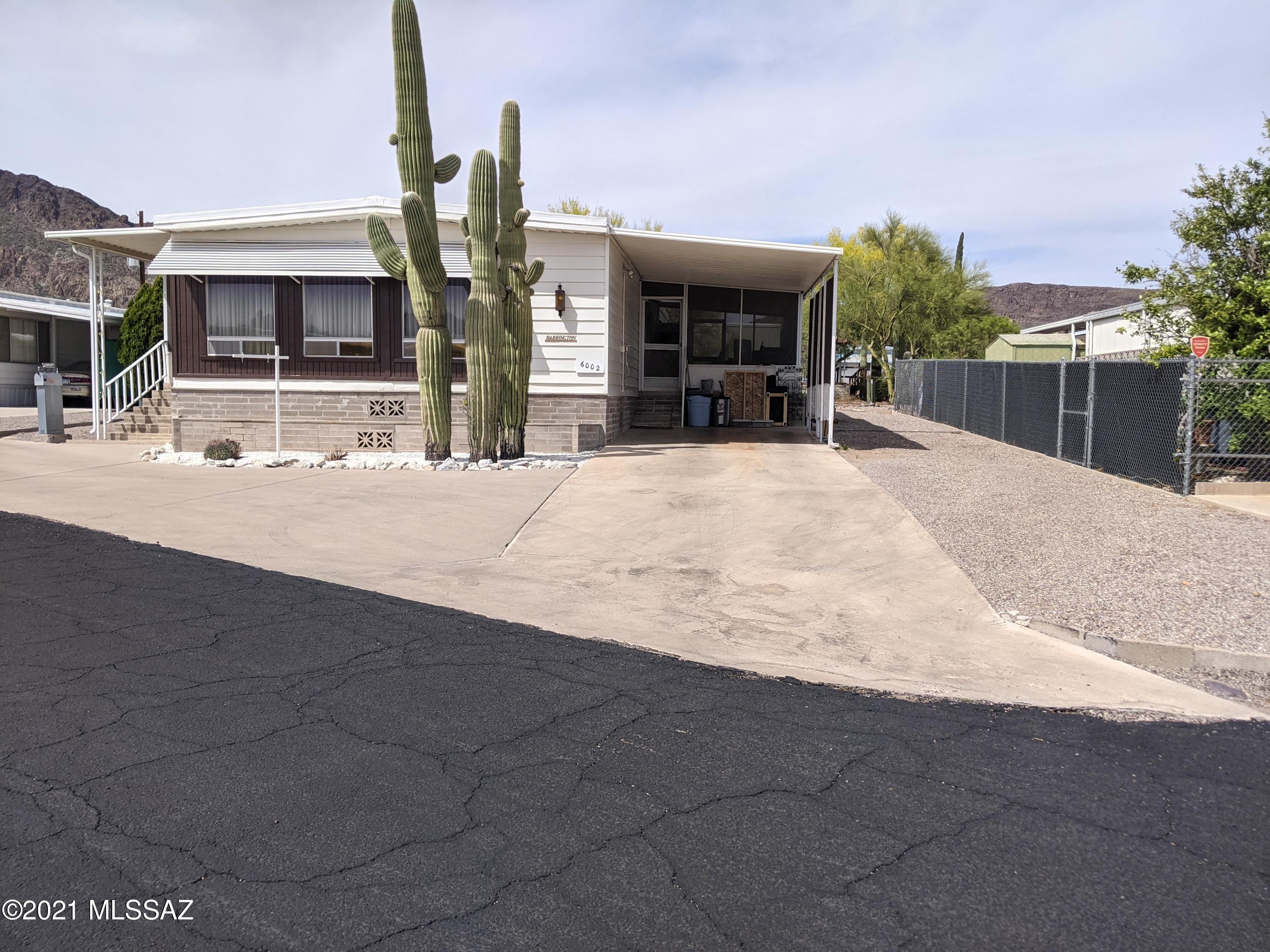 This move-in ready home is elevated and centrally located between the golf course and the pool! Home provides nice mountain and/or sunset views, great for entertaining friends/family.                                                                                                                                                                                   Kitchen   includes newer appliances - gas stove-top, refrigerator, microwave built-in kitchen table and pantry. Open floor plan with dining area and living room, fans, over-sized bedrooms, master bedroom has two closets and a double vanity, extra storage and new HVAC system in 2016 and recent roof re-coat. Furnishings in the home can stay! HOA provides many amenities: pools, spas, golf, tennis, Rec center, shuffleboard and more!