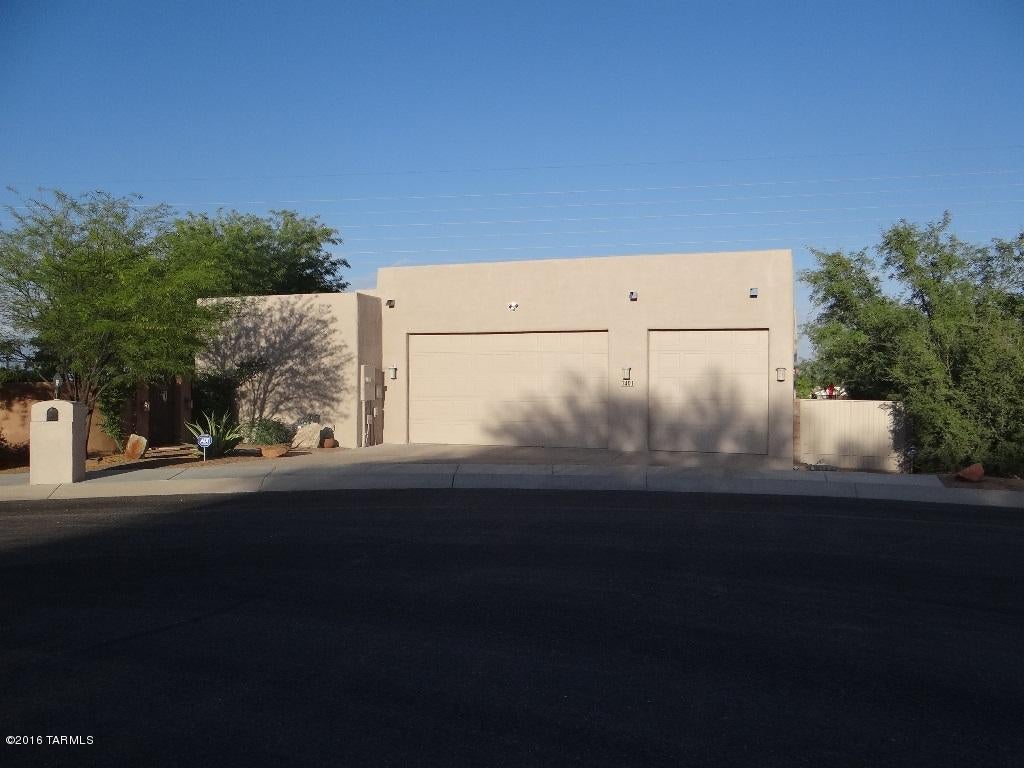Don't miss this executive home on an elevated view lot in beautiful & peaceful Sahuarita. Walk in through the gated & lush courtyard to the grand dlb door entry to see what this home has to offer; a chef's delight kitchen with upgraded appliances, granite counters, B.fast bar, island, & 5 burner gas range. Enjoy the high ceilings,lg view windows, split f.plan, jack & Jill bath, guest quarters, dual cooling, & diagonal tile. This home is great for entertaining and offers a large wrap around patio to enjoy the cool evenings, mountain views, pool/spa with water feature, & built in grill. Whether you are a car enthusiast, handy person, or have lots of stuff....this 4 car garage with storage & work area is a bonus!! pool& pest service included.