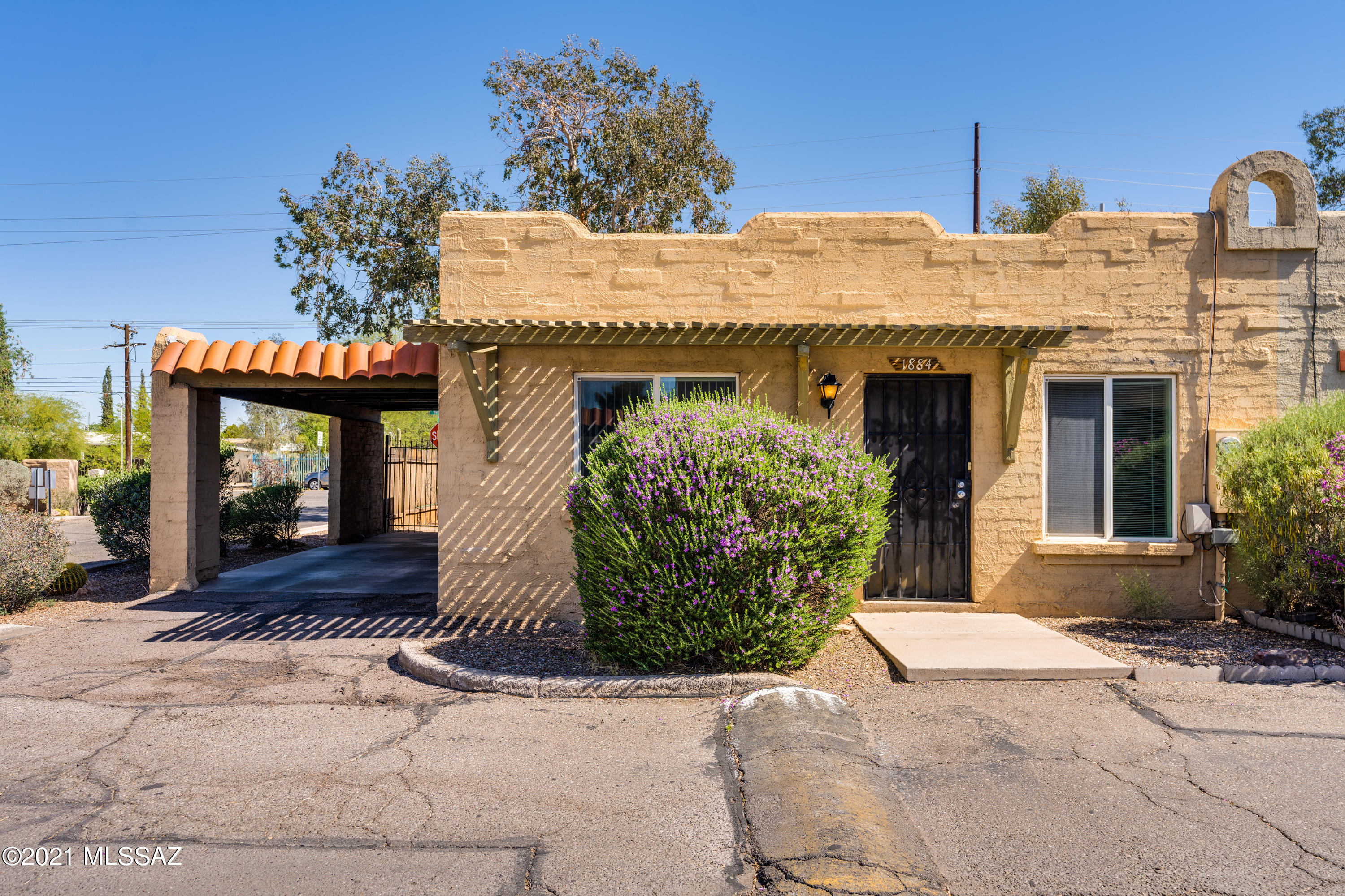 Centrally located within the small community of Casitas De Valle, this move-in ready townhome features 2 Bedrooms/1 Bath (821 sq ft). Open floorplan. Beehive fireplace. Spacious fenced yard with covered patio area. 1 Car Carport. Community Pool. Corner lot/end unit.