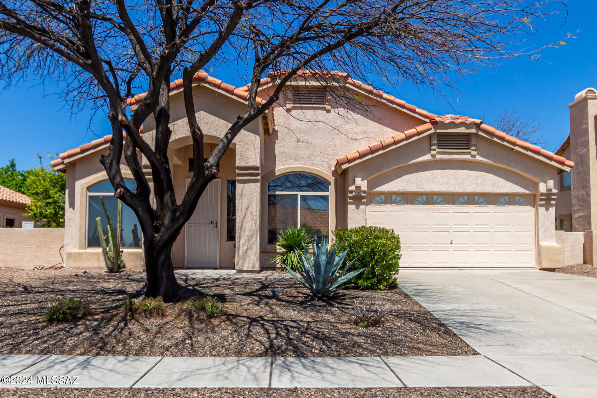 Welcome home to this exceptional property nestled in a prime location in La Cholla Estates. Step inside to discover an inviting open floorplan with soaring high ceilings and abundant natural light, creating a warm and welcoming atmosphere. Priced below appraisal, this gem features 3 bedrooms, 2 baths, a north-facing covered patio for year-round relaxation, and a convenient 2 car garage.  La Cholla Estates includes Golden Rose Park, offering play equipment, a basketball court, and scenic desert walking trails for outdoor enjoyment.
