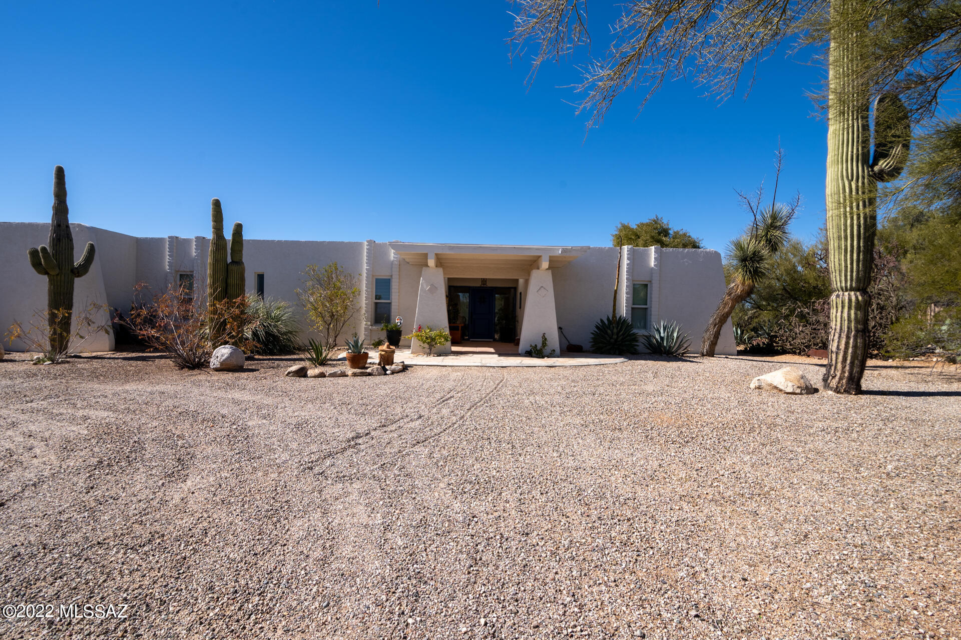 Your private Foothills retreat awaits you in the highly sought after Catalina Foothills Estates 7. 2392 SF Territorial style estate home featuring three bedrooms/three bathrooms plus Den with pleasing floor plan and warm natural lighting. Multiple French doors open to patio with built-in outdoor kitchen & bar. Situated on an acre+ high above large natural riparian area increasing your privacy. The backyard paradise welcomes your family and guests with lush mature landscaping & just refurbished pool. Enjoy majestic Santa Catalina mountain views, colorful sunsets & city lights from your secluded retreat. This charming, private neighborhood reflects pride-of-ownership throughout, with recently paved streets, and resident-managed HOA.