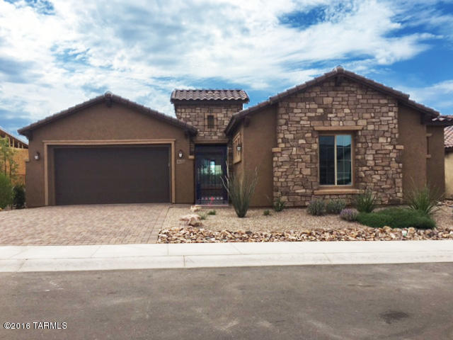OWN THIS EXQUISITE 3415 SF. FORMER MODEL HOME WITH TONS OF UPGRADES!!! 4 BED, DEN, FLEX ROOM, 3.5 BTHS, 2.5 CAR GARAGE.  HOME COMES WITH GUEST SUITE WITH PRIVATE COURTYARD PERFECT FOR GUESTS/FAMILY.  9000+ SF LOT W/ SPECTACULAR EAST CATALINA MOUNTAIN VIEWS WITH NO HOME BEHIND. GAS FP ON PATIO, BUILT-IN BBQ, TURF AND MORE! PAVER DRIVEWAY AND AWESOME FRONT COURTYARD.  THE KITCHEN FEATURES UPGRADED KITCHEN AID ELECTRIC SS APPLIANCES.  QUARTZ COUNTERTOPS, ESPRESSO CABINETS W/ SOFT CLOSE/DOVE TAIL DRAWERS & ROLL OUTS.  ISLAND IN KITCHEN INCLUDES WHITE PAINTED MAPLE CABINETS.  FLOORING IS 12X24” TILE, HARDWOOD AND UPGRADED CARPET.  HERS SCORE OF 65, 10’ CEILINGS; 8’ DOORS, NATURAL GAS HEATING AS STANDARD.