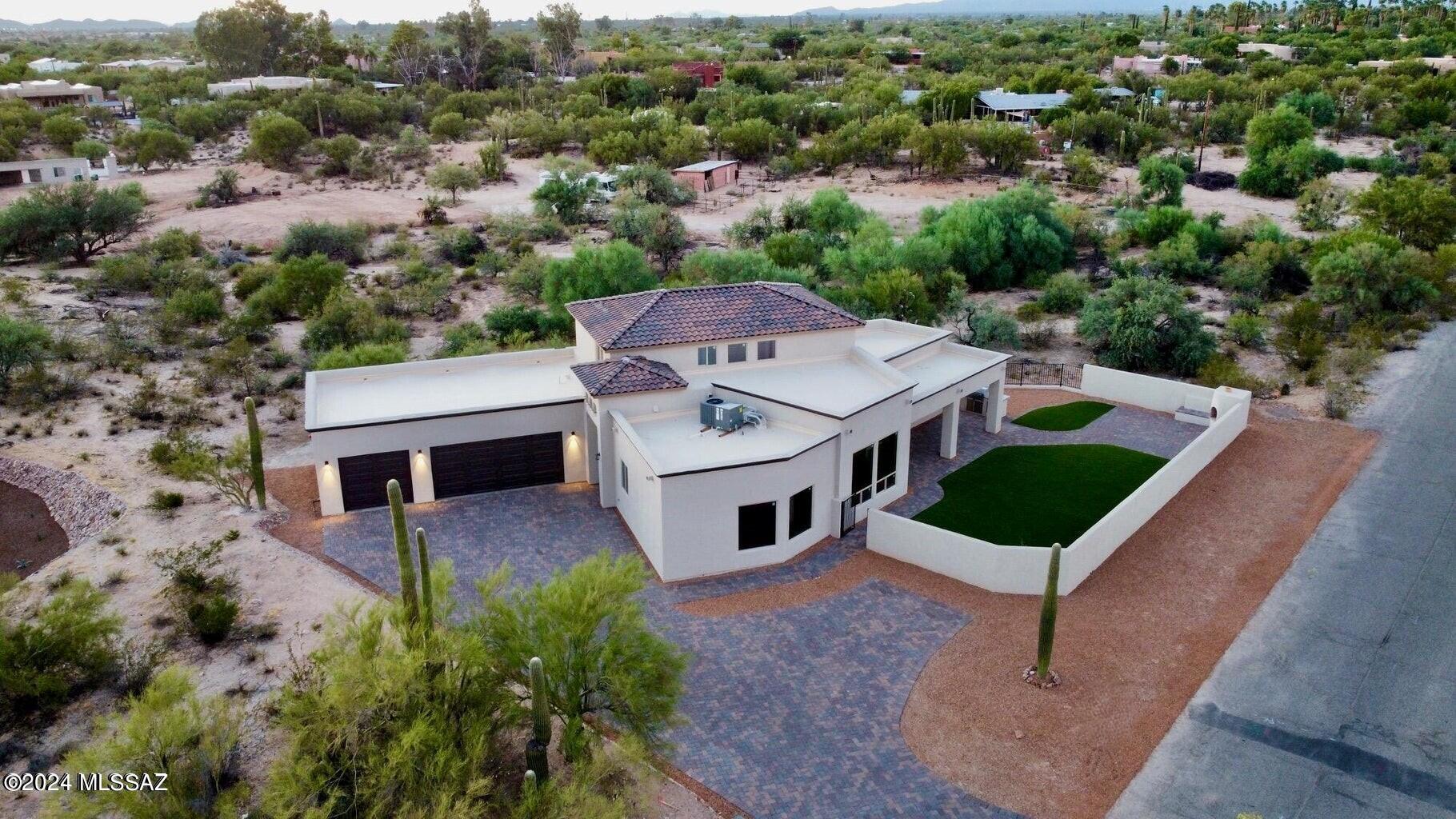 NEW CONSTRUCTION!
This one has it all. Fantastic mountain views plus a city lights view.  Incredible 6 ft by 10 ft Wrought Iron Entry Door, 8 ft interior Doors, Custom Kitchen with Quartz Counter Tops and a Large Island, Walk-in Pantry, Mud Room from the garage, amazing Laundry Room. The Owner's Suite Bathroom is unbelievable! Finished yard with upgraded Artificial Turf, Fireplace, Built-In Grill, Stucco Block Wall, Double Refrigerator/Freezer. And so much more, along with a highly sought after location amid million dollar homes.