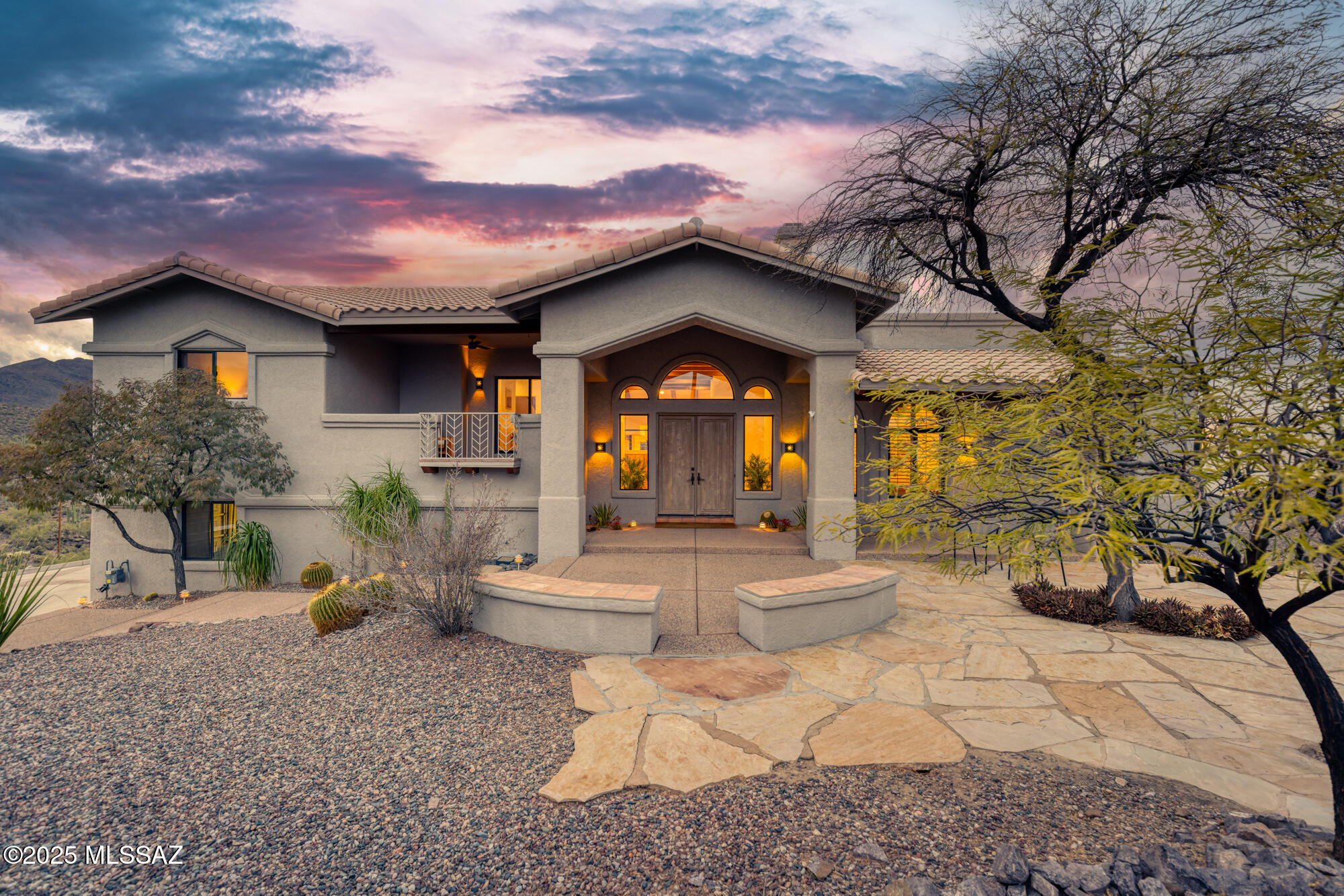Breathtaking 360-degree views of Tucson Mountains and city skyline at every sunrise and sunset from multiple viewpoints. The grand entry leads you into impressive vaulted-beamed ceilings and over 3,300 square feet of airy living spaces with stunning views from every window. An entertainer's dream home featuring multiple patios, a sparkling pool, and a built-in BBQ - all creating a resort-like experience. The spacious split floor plan includes 3 bedrooms and 3 bathrooms, highlighted by an expansive primary suite. Two gas fireplaces, one in the primary and one in the great room, add warmth and charm. Practicality meets elegance with ample storage throughout, especially in the oversized 3 car garage.  See more... Located in the serene, gated Sunset Hills neighborhood, you'll enjoy easy access to the I-10 corridor, downtown Tucson, the Mercado and much more. For outdoor enthusiasts, embark on a stroll, hike, or swim from your own backyard. Surrounded by the beauty of Tucson Mountain Park, Saguaro National Park West, Sweetwater Preserve, and county land, you'll have endless opportunities for hiking, biking, and exploring.