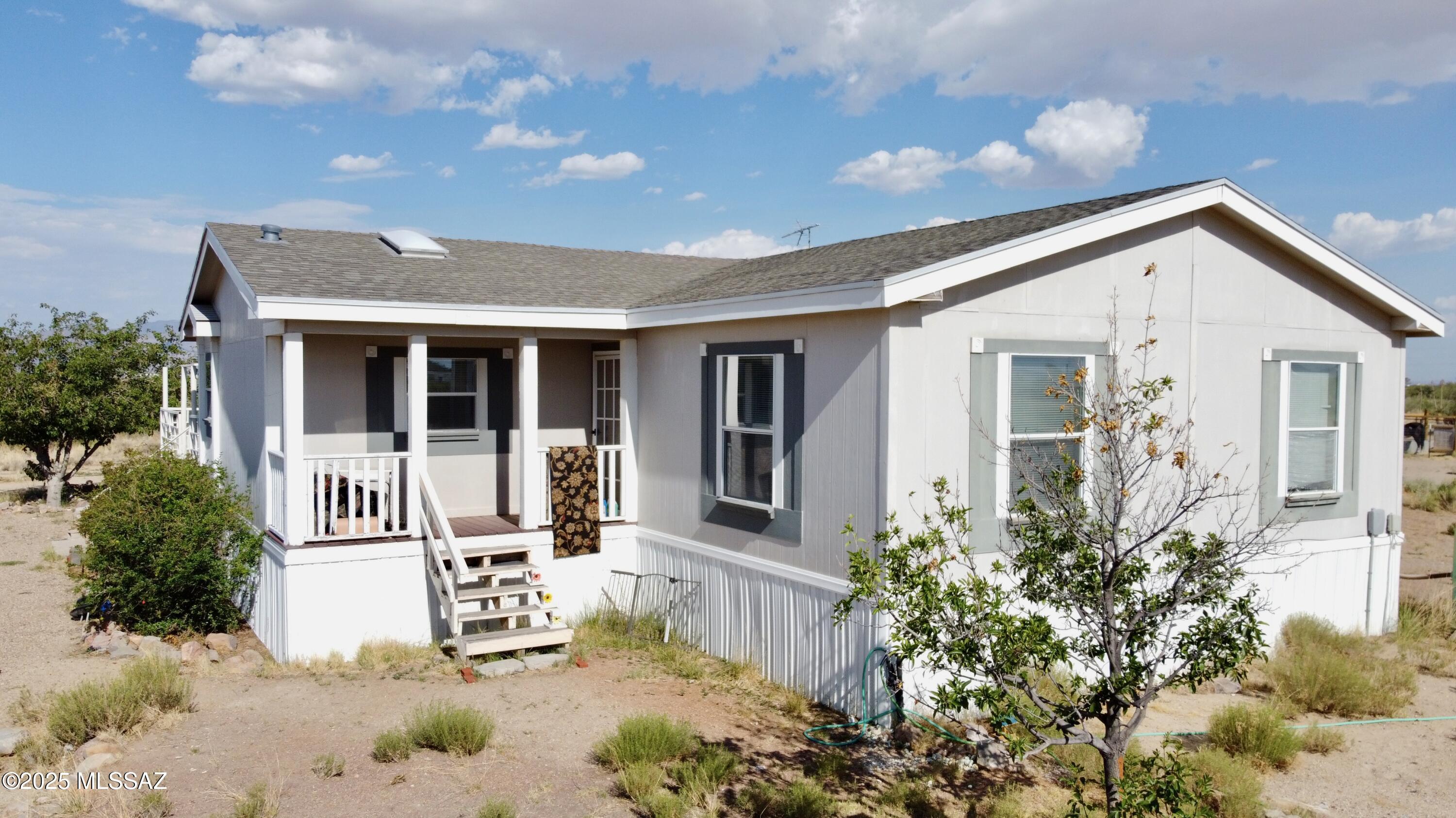 VA Assumable Loan Balance owing September 1st 2025 $195,342.51. 
$212.63 goes toward the principal so as of September the amount owing will be $195,129.88. Rate is 5.75% Total monthly payment is $1427.15.
Beautiful and well-maintained 3-bedroom, 2.5-bath triple-wide manufactured home situated on 2.5 acres in the peaceful countryside of Willcox, Arizona. This spacious home features an open-concept layout with a large living and dining area, perfect for family gatherings or entertaining guests. The generously sized kitchen includes abundant cabinetry, ample counter space, and a propane gas stove--ideal for cooking enthusiasts. All appliances are included, making this home truly move-in ready. The primary suite offers a private bath with a soaking tub and separate shower, while two additional bedrooms share a full bath. A guest-friendly half-bath adds extra convenience. You'll also appreciate the large laundry room with extra storage and workspace.Enjoy Arizona's stunning scenery from the expansive deck, perfect for outdoor dining, relaxing, or taking in the mountain views. The property also includes a barn and a small horse facilityideal for equestrian use, livestock, or hobby farming. A private well provides reliable water, and the 2.5-acre lot offers plenty of space to roam.
Additional highlights include a recent engineering certification qualifying the home for FHA and VA financing, as well as an elevation certificate from the seller that helps lower flood insurance costs.
This property offers the perfect blend of rural charm, functionality, and comfortready for you to call home.
