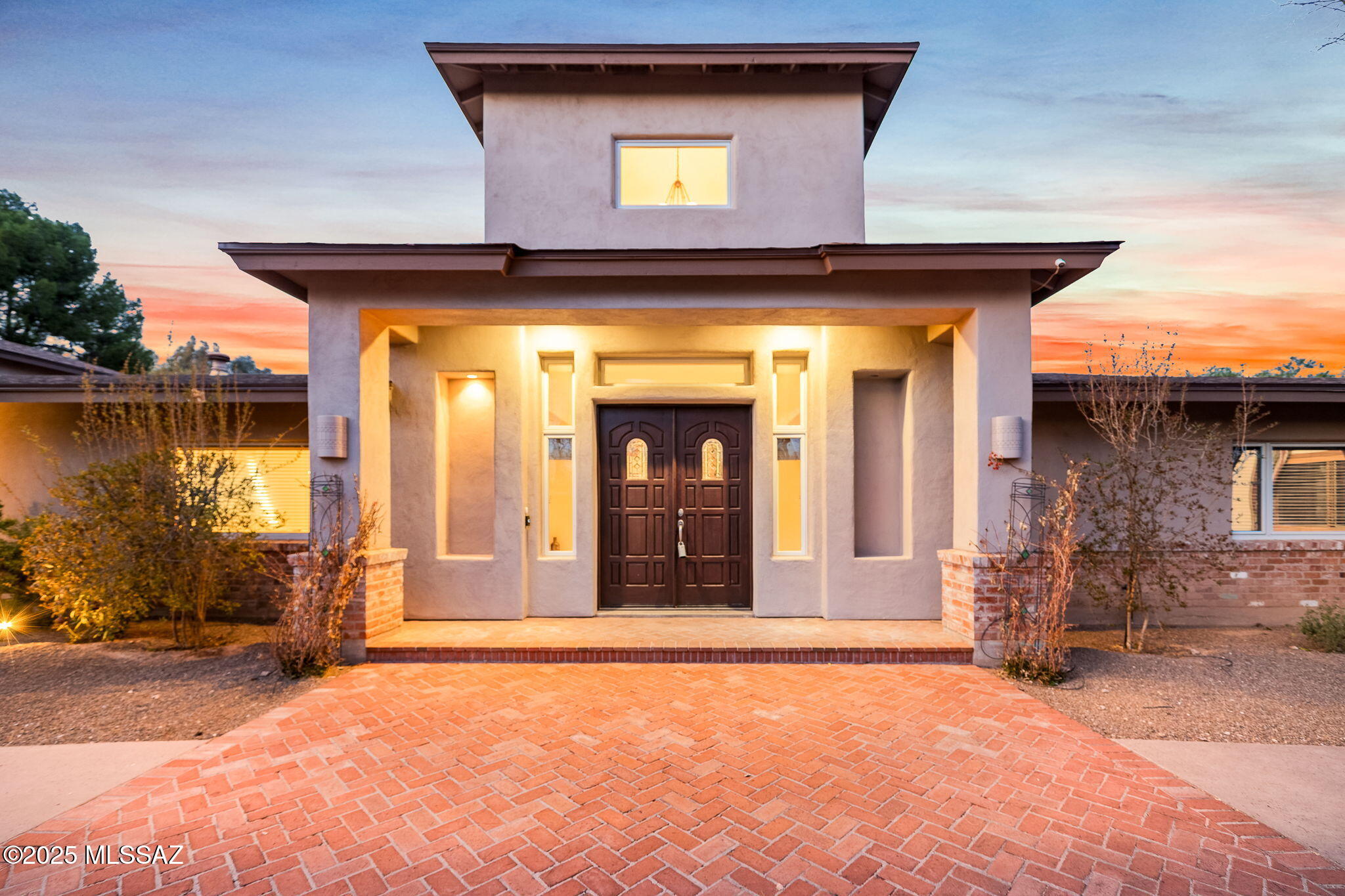 Discover the epitome of luxury within the exclusive Tucson Country Club community with this signature residence! Upon entering through a distinguished and significant double door foyer, you'll be greeted by a stunning great room featuring soaring 16-foot ceilings and a custom stone fireplace! The space is accentuated by built-in, lighted art display bookcases, providing both utility and artistic flair. Culinary enthusiasts will be captivated by the sensational kitchen, adorned with granite countertops, stainless steel appliances, and a convenient breakfast bar. It boasts a gas stove top, double ovens, a prep sink, and even a built-in wine cooler, complemented by ample pantry storage and rich, solid wood plank flooring. The home seamlessly accommodates formal gatherings in the exquisite dining room, complete with a wet bar and a stylish two-way fireplace - a perfect blend of elegance and functionality. The primary suite is a true retreat with spa like bathroom and fireplace. Adjoining the primary bedroom, a truly remarkable library/study awaits, featuring 18-foot high ceilings and walls of bookcases, ideal for the dedicated reader or professional. Guest bedrooms are thoughtfully arranged in a split plan to ensure privacy, each graced with wood-cased windows and elegantly tiled bathrooms. Outside, a Secret Garden offers a private retreat, while the expansive backyard is designed for entertainment, showcasing a covered patio and a beautiful pool amidst serene fruit trees.

Functionality meets style in the pantry/laundry room, streamlining everyday tasks with ease. Don't miss the brand new roof, one new hvac unit, fresh interior repaint, new toto toilets! This property isn't just a home - it's a lifestyle, masterfully combining luxury, comfort, and sophistication. Come explore this magnificent residence that promises to impress at every turn!
