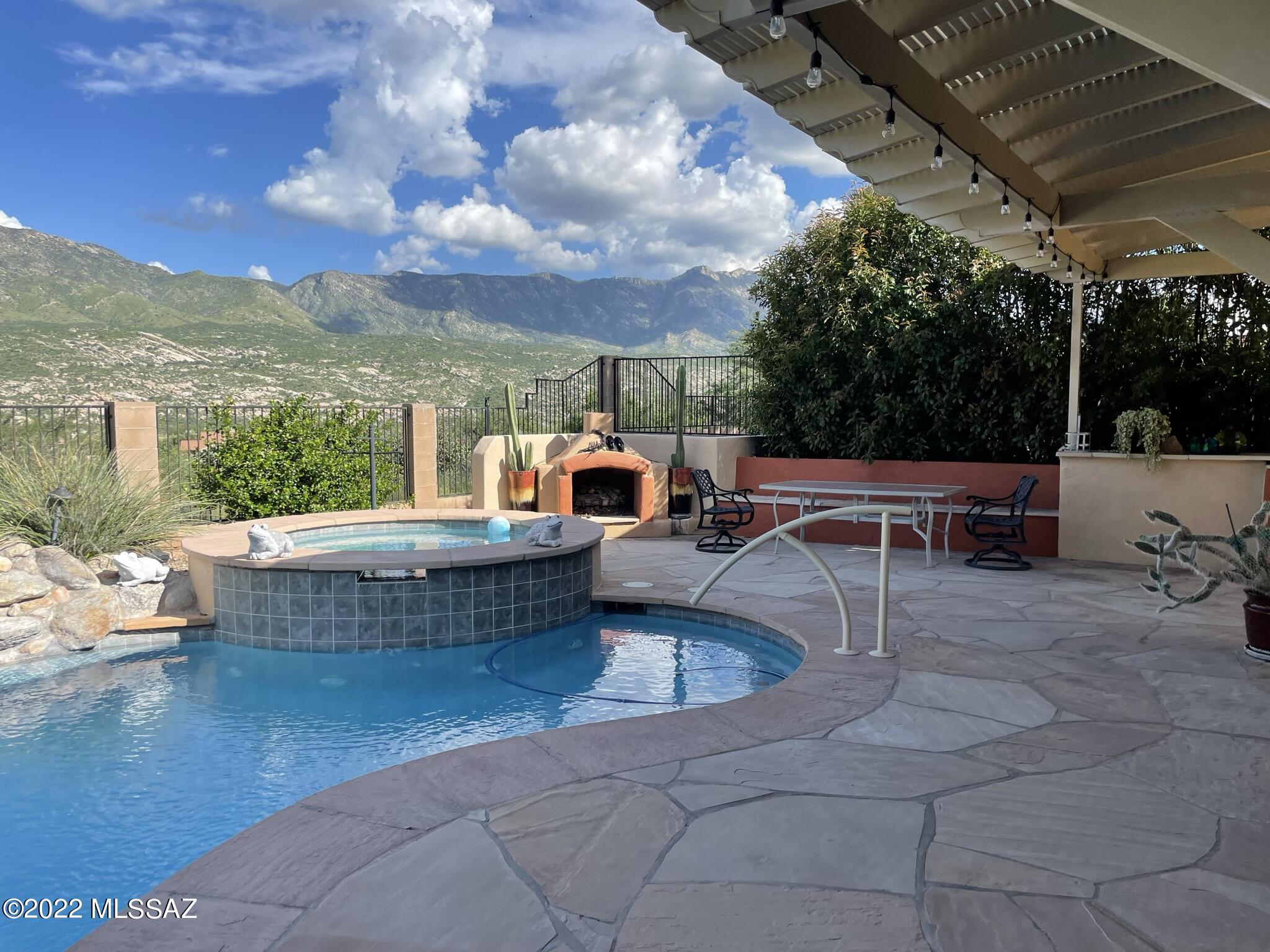Fabulous Catalina mountain views from this beautifully customized Sonoran model in SaddleBrooke's Preserve. Enter through the courtyard where the casita awaits. Entertain from the patio enjoying the pool, spa, kiva fireplace with mountain backdrop. Great room fills with light from panels of glass to patio. Open island kitchen with spacious eating area and patio access. butler's pantry and walk-in pantry lead to dining room. Spacious owner's suite and sitting area, mountain views, split vanities, soaking tub and expansive closet connecting to laundry room. Plenty of privacy for guests in casita or guest suite. Upgraded cabinets and doors. Updated HVAC, pool pump, sunshades, and tankless water heater. Resort living at its best!