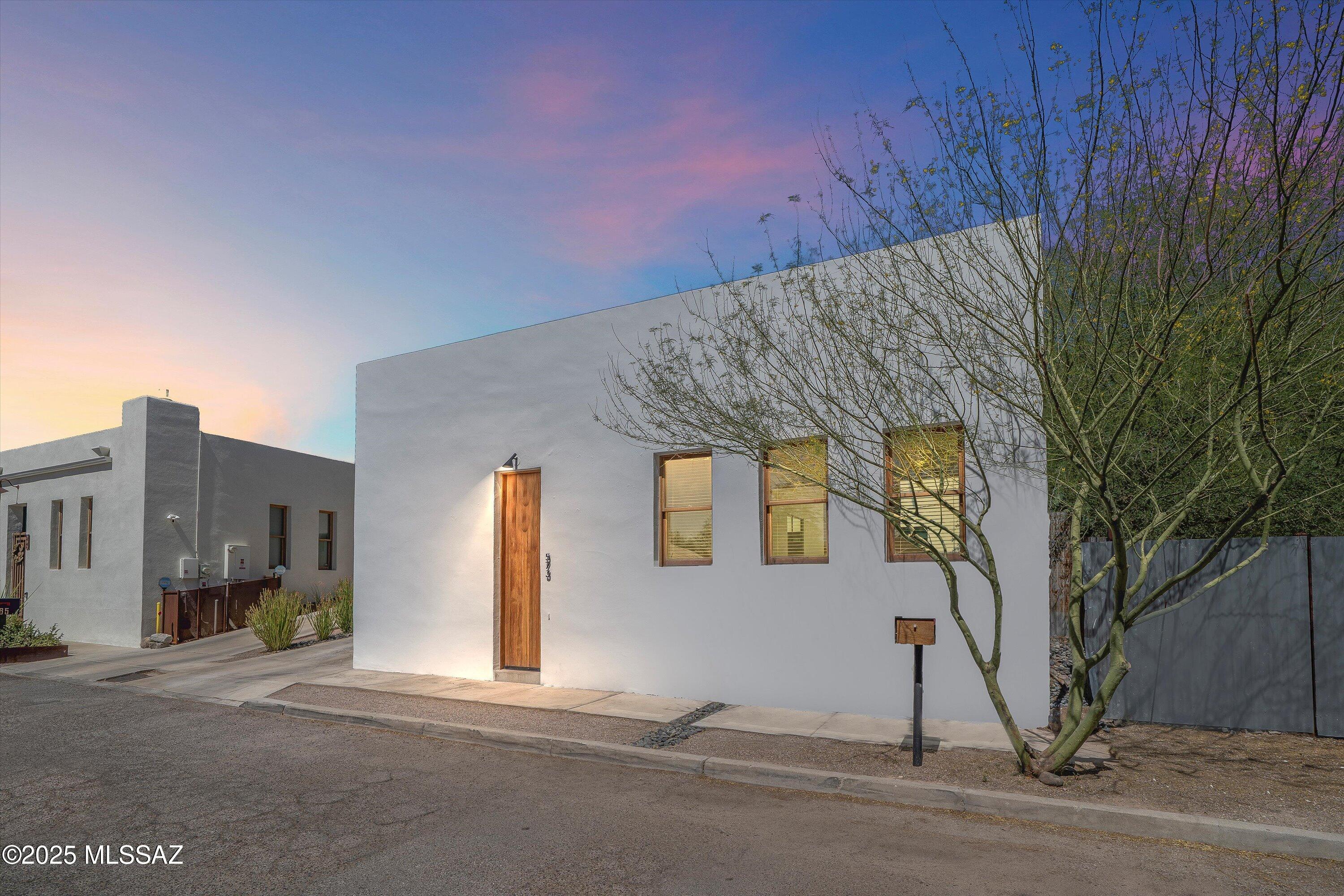 Fabulous Architect-designed home, by Award Winning, Internationally recognized HK Associates, Inc. This unique home in Tucson's historic Barrio Viejo blends timeless character with modern features. The home is designed around a private interior courtyard with a pool. Home is 4BR/3BA & includes a separate Guest Suite. High ceilings, open layout, energy efficient construction with Fox insulated block, owned Solar PV system, 2-year-old 19-SEER HTPP,  Concrete floors, and more! Chef's kitchen with gas cooktop, wall oven/microwave, & butler's pantry. Spacious Primary Suite boasts a Custom walk-in Closet and luxurious bath with a walk-in shower. All bedrooms have built-in closets, baths with dual flush bidet toilets, and extended tile surrounds. The Utility/Storage Room has built-in Cabinets. Large heated/cooled Garage with storage cabinets and workshop area. Guest Suite with Murphy Bed, Bath and Outdoor Shower. The interior courtyard creates seamless indoor-outdoor living with space for lounging and entertaining. The Guest Suite is ideal for guests or as a separate home office. Enjoy the walkability to downtown, cultural venues, and local dining. The home was thoughtfully designed for low maintenance, energy savings, and is the perfect balance of historic charm and contemporary luxury in one of Tucson's most sought-after downtown neighborhoods. Be sure to see the home today!