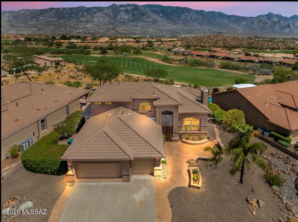Stunning Upgraded Sundance model with Panoramic Mountain Views, Elevated Lot, and Golf Course View overlooking Hole 1 of Mountainview. 3 beds with primary on main floor,  primary bath has soaking tub, walk-in shower, 2 walk-in closets, and built-in ironing board. Upstairs bedrooms share a Jack & Jill bathroom.  Gorgeous 24'' Travertine Tile throughout the main floor (just regrouted & professionally cleaned).  Gourmet kitchen w/ granite countertops, pullouts, and lots of storage, heating lamps, gas top, and Wok top!  Extended 3-car garage with utility sink and attached cabinets. Owned Solar (avg electric bill $36.00). All windows upgraded 2017-2023, 3 zone HVAC all replaced in 2020,  Ting monitoring system. Meticulously maintained - this home is a must-see!
