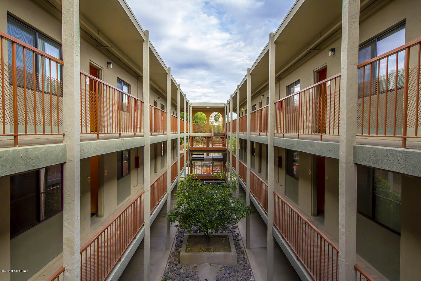 This is a rare once in a lifetime opportunity to own prime property directly next to a major university, which is turnkey and does not need renovation. Superb existing financing must be assumed by Buyer. FNMA loan: $3,000,000 @3.99% 10 year stop (from 12/17). Non-recourse AND Assumable! Major capital improvements have been done including all new windows, HVAC units, water heater, exterior paint and trim, landscaping & security cameras. 20 ''A'' units have granite, hardwood, mirrored doors on closets and dishwashers. Six units have upgraded flooring and B-level cosmetics. 15 ''B'' units feature tasteful carpeting in bedroom and living area and tile or VCT in baths and kitchen. All units have modern, tasteful cosmetics. B units are easily & inexpensively converted to ''A'' units. Owner/Agent