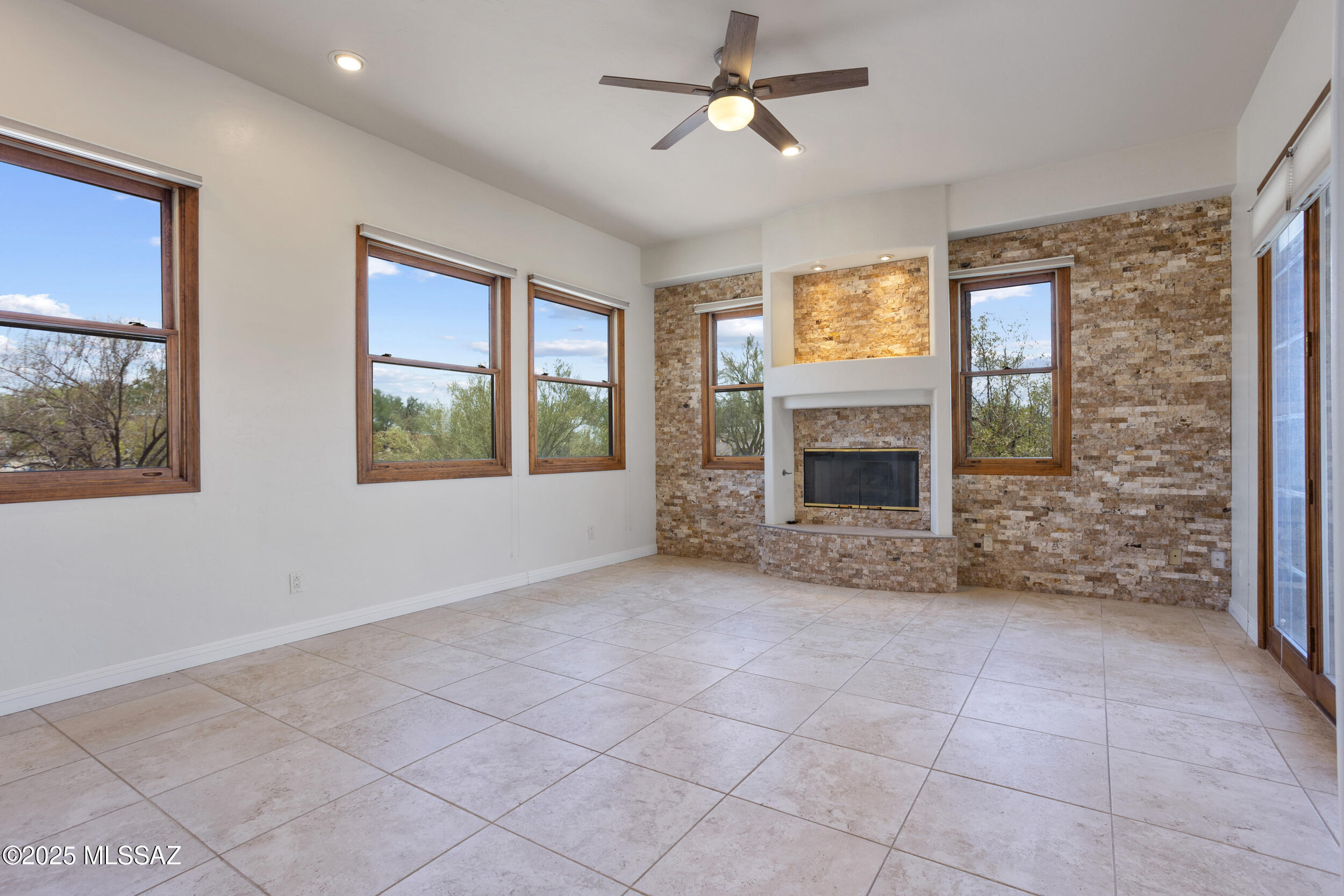 Stunning 3,452 sq. ft. home in gated community on 3 acres! Boasting breathtaking panoramic mountain views, this 4-bedroom, 2.5-bathroom property combines modern luxury with serene desert living. New tile flooring, gas fireplace with stacked stone, and a 3-car garage with extra storage. Upstairs: private primary suite features a jetted soaking tub, separate walk-in shower & dual sinks. Downstairs: 3 bedrooms, a cozy bar area, fireplace, and access to the covered patio.  Outside, enjoy resort-style living with a heated pool and spa, all surrounded by the natural beauty of your expansive acreage. Located just 10 minutes from shopping, restaurants, and other amenities, this home offers the perfect blend of privacy and convenience. Don't miss this rare opportunity to own a slice of paradise.