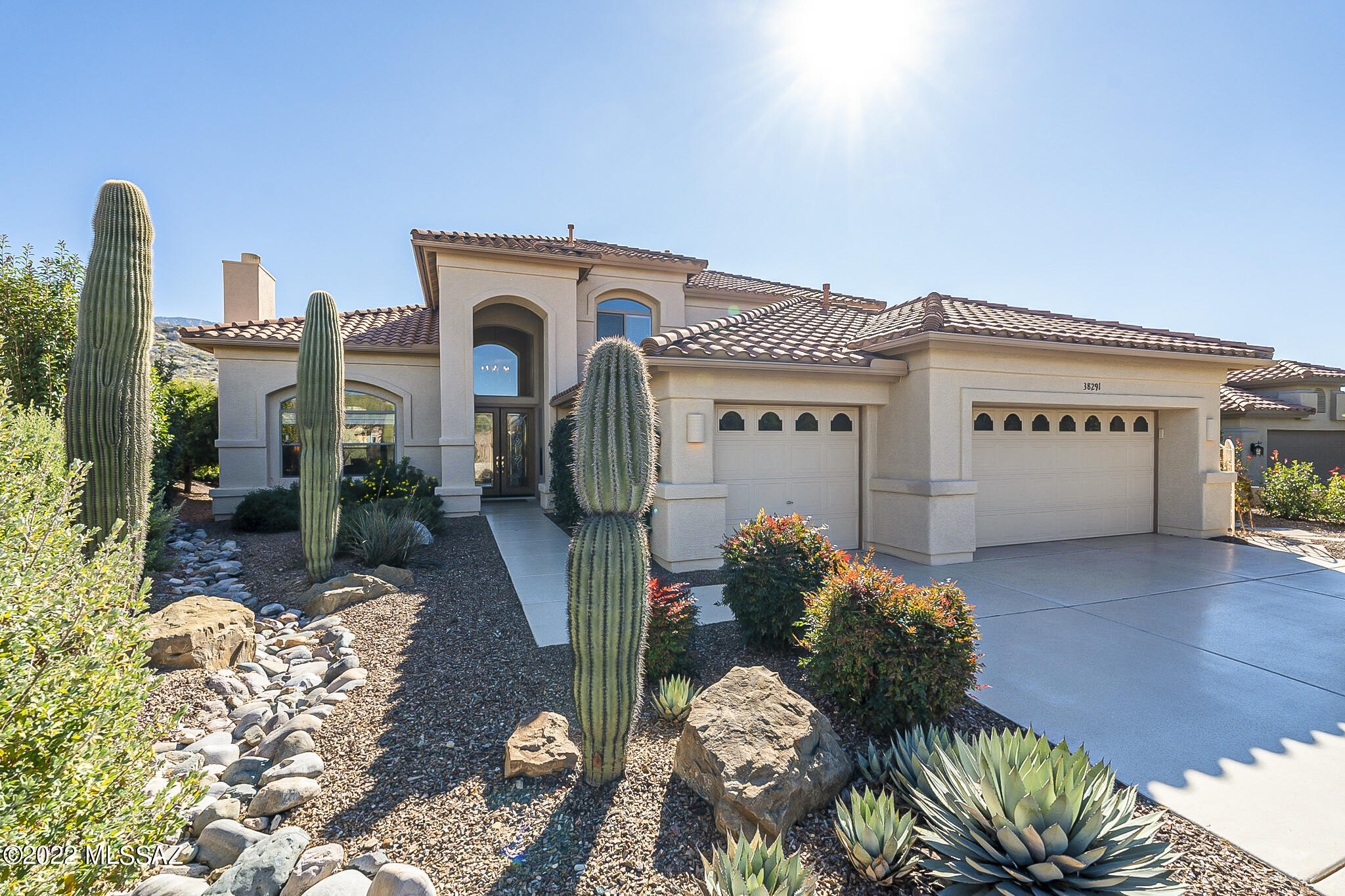 Breathtaking, totally unobstructed mountain views from this stunning Sundance model! Enjoy abundant wild life, glorious sun rises & serene privacy from the home's many walls of windows + fully covered patio & backyard. Kitchen boasts 5 burner gas stove, cherry cabs w/pull outs & farmer's sink. Large master suite w/His & Hers closets, slider to patio, neutral carpet & huge block shower. Downstairs den/office w/French doors & wood blinds. Two large bedrooms, Jack & Jill bathroom + two closets up the striking, spiral staircase to the second floor. All new sunshade window treatments in relaxing family room. Powder room w/pedestal sink. Exterior repainted in 2018, new irrigation system in 2019, alarm system, Kinitco water system, epoxy coated driveway, front walkway & 3 car garage.